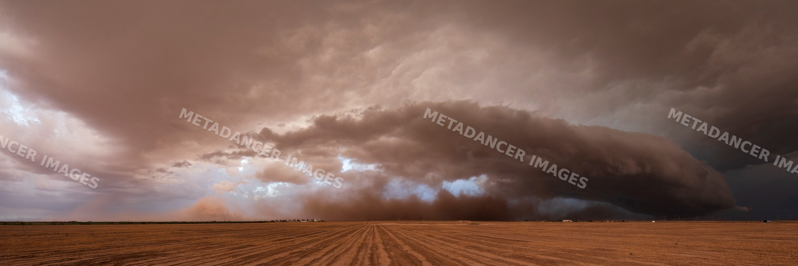 Supercell thunderstorm over plowed field near garden city texas
