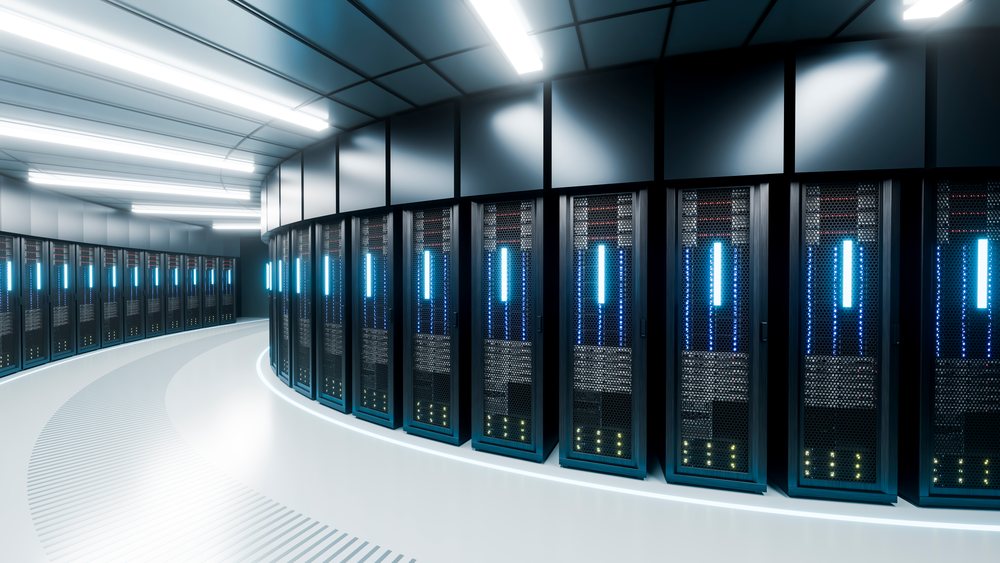 Server racks aligned in a modern data center room with illuminated