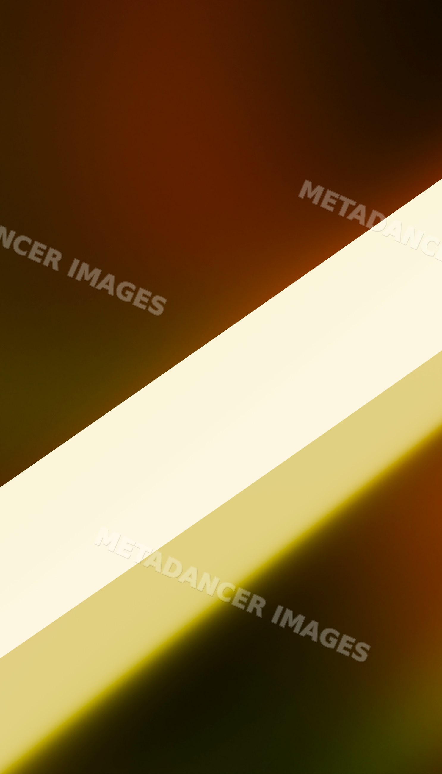 Diagonal beam of bright light with abstract shadow contrast