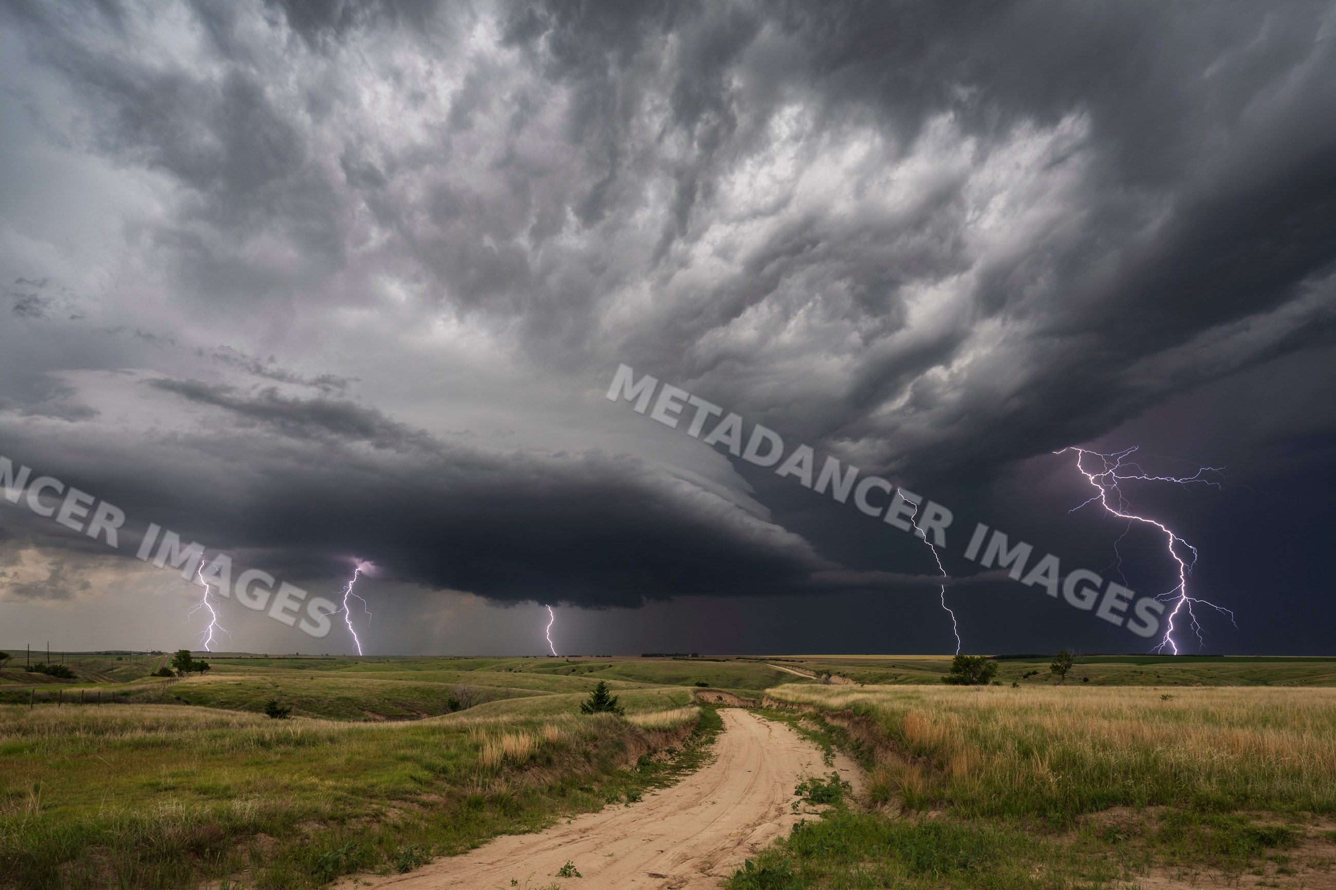 Lightning strikes over grassland thunderstorm in wallace nebraska