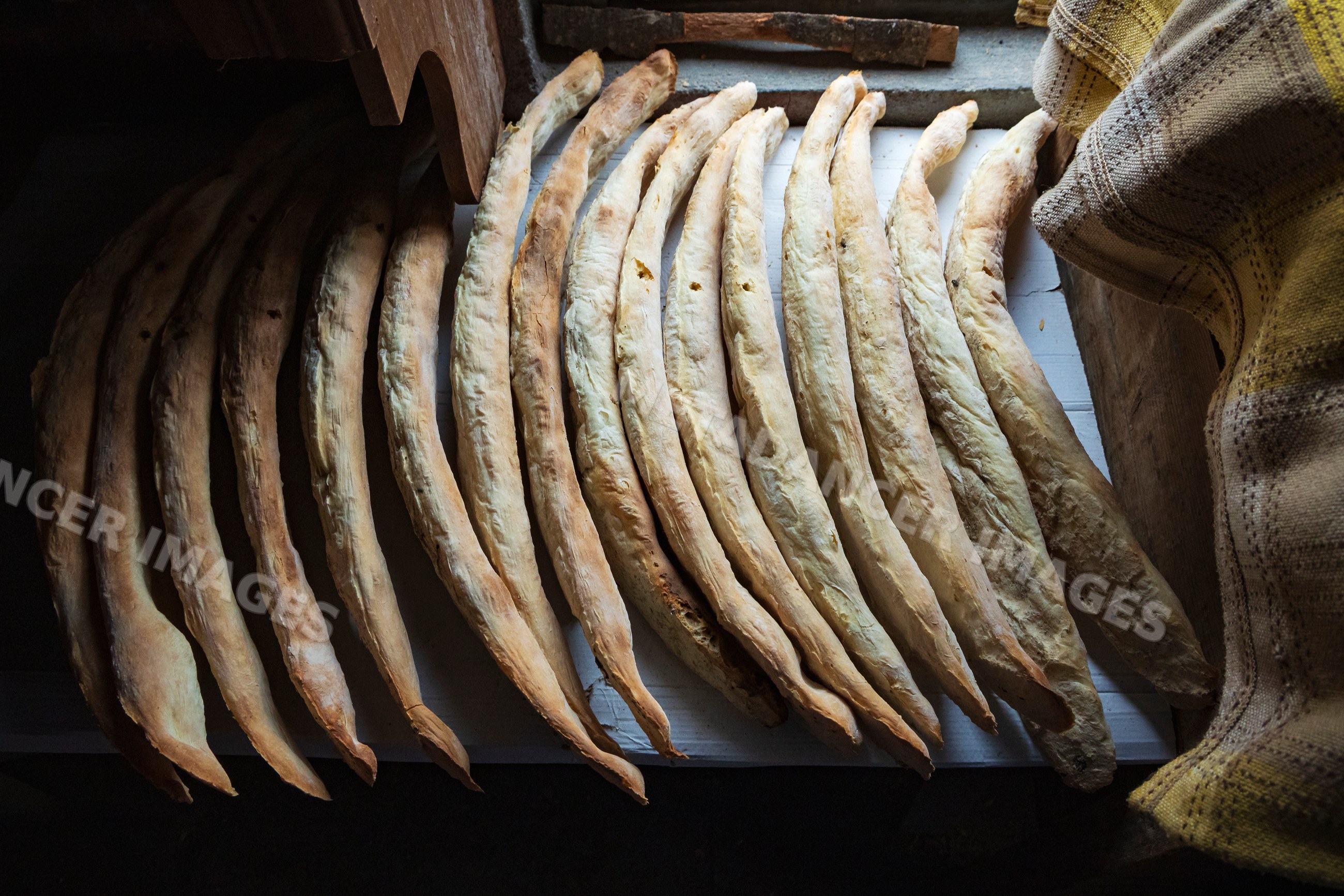 Georgian Lavash bread drying on a wooden surface in badiauri, Georgia