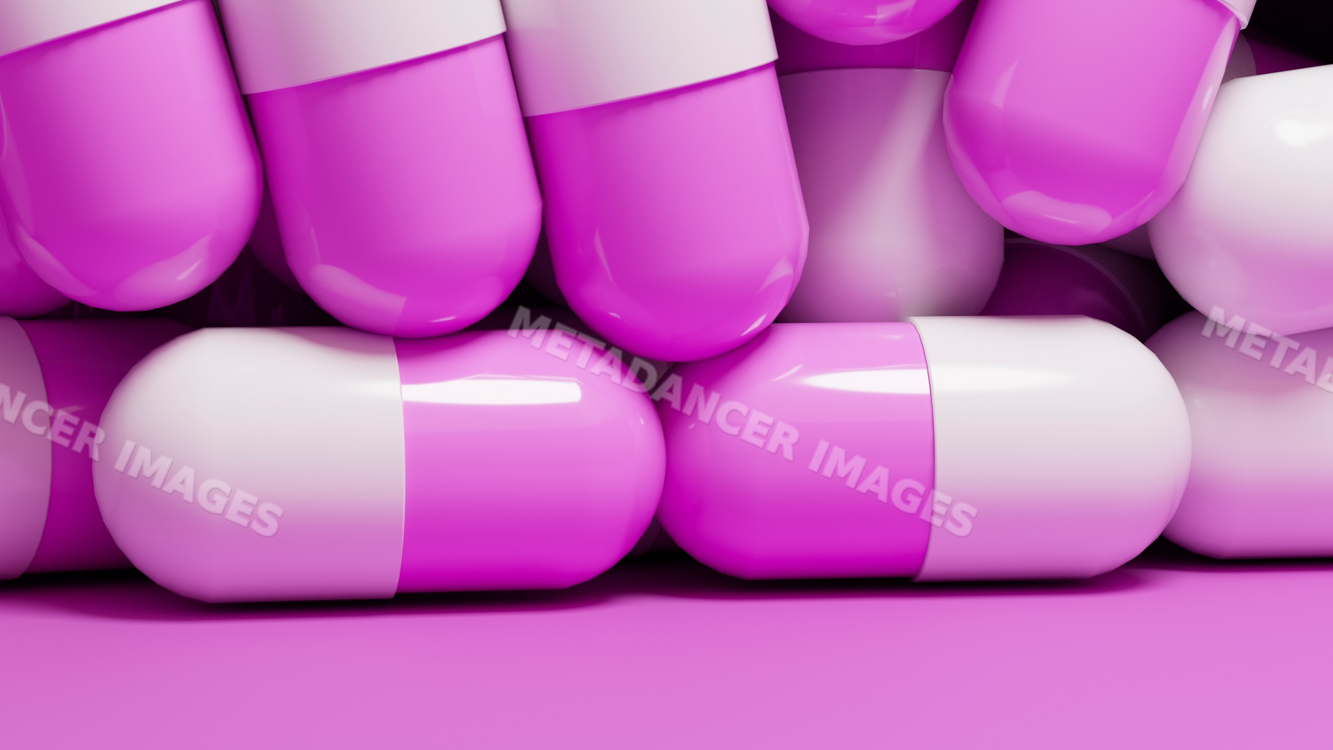 Medication capsules with white and pink halves stacked closely