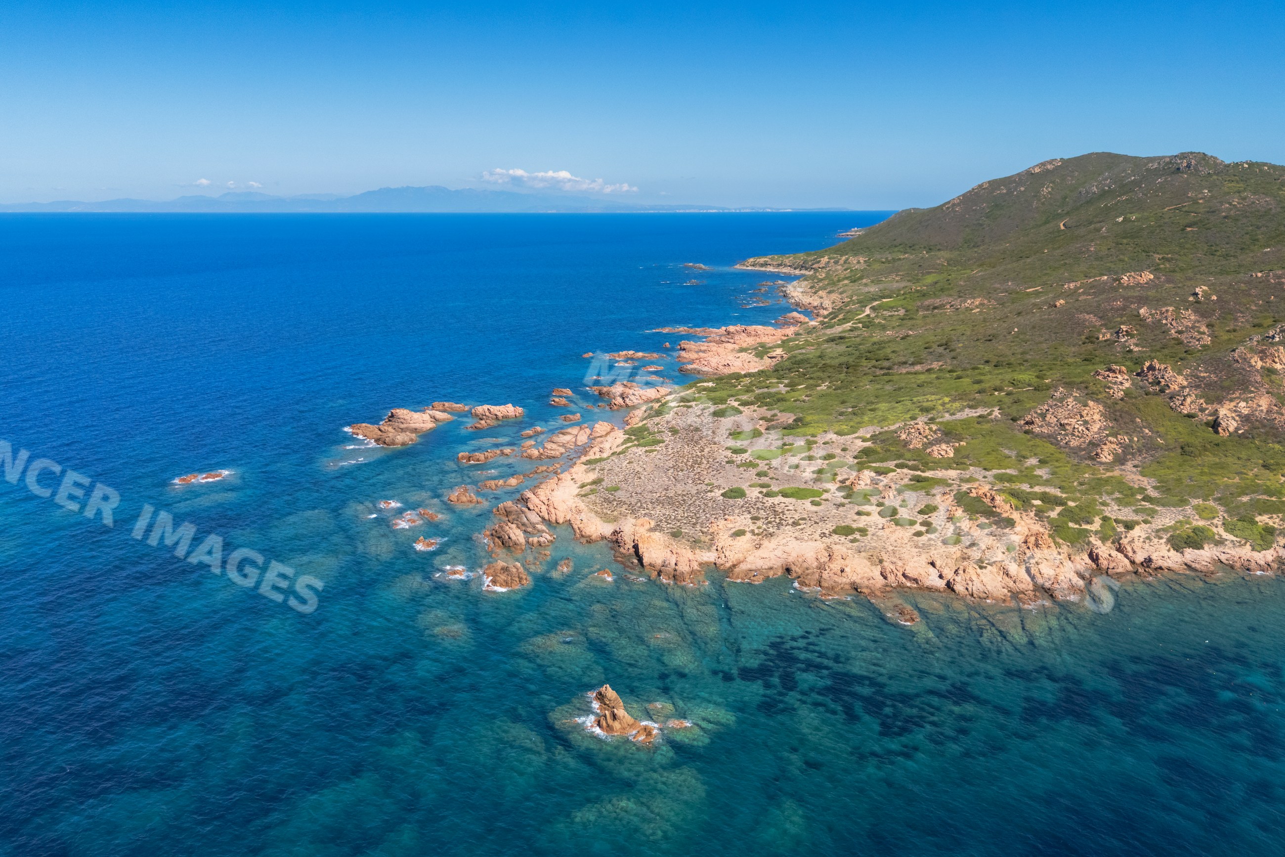 Aerial view of Cala Sarraina coastline in sardinia, italy