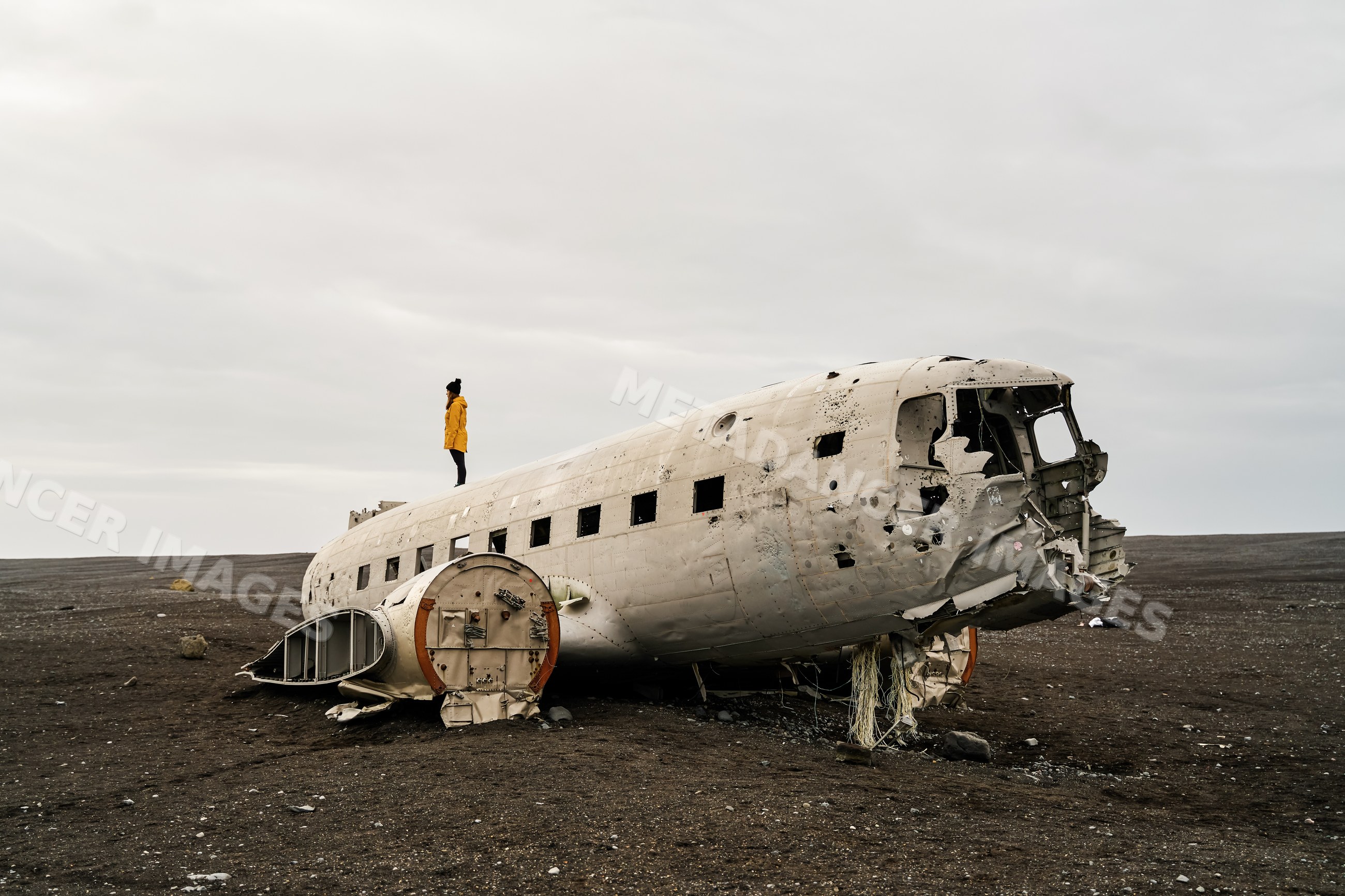 White Person standing on abandoned plane wreck