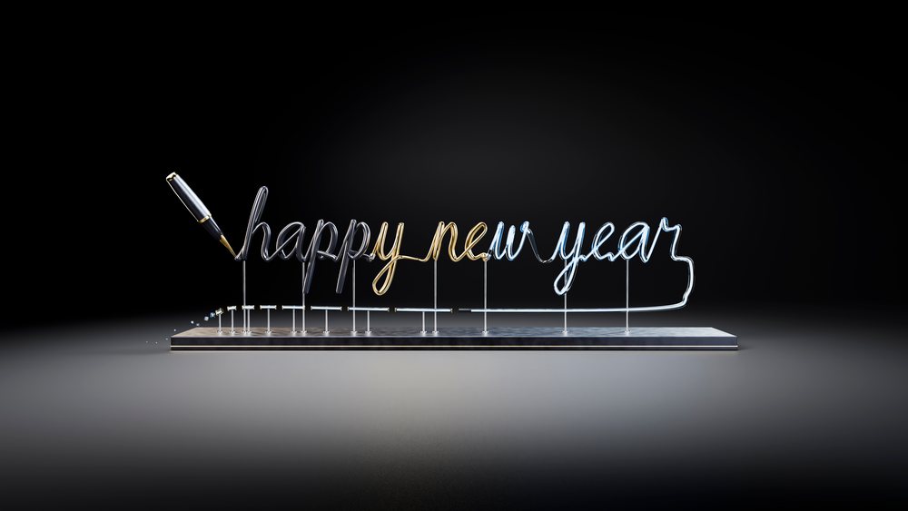 Metallic calligraphy sign saying happy new year on dark background