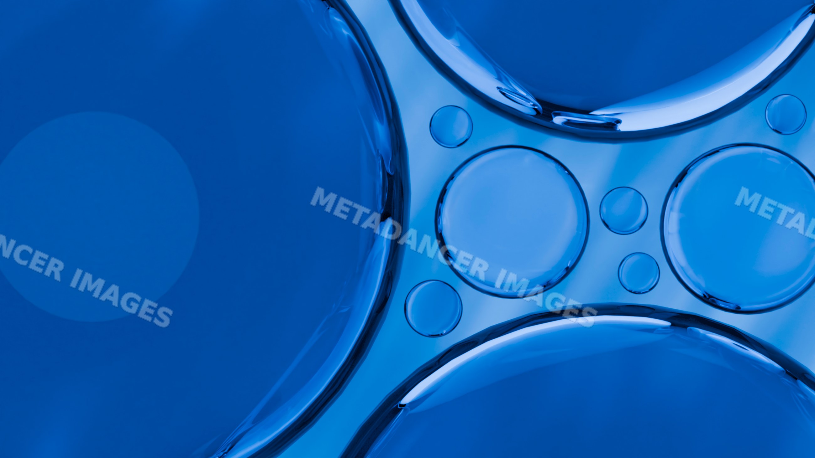 Blue liquid surface with circular bubbles and reflections close-up