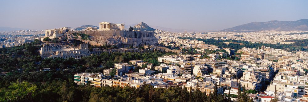 Acropolis ancient ruins overlooking urban athens cityscape greece