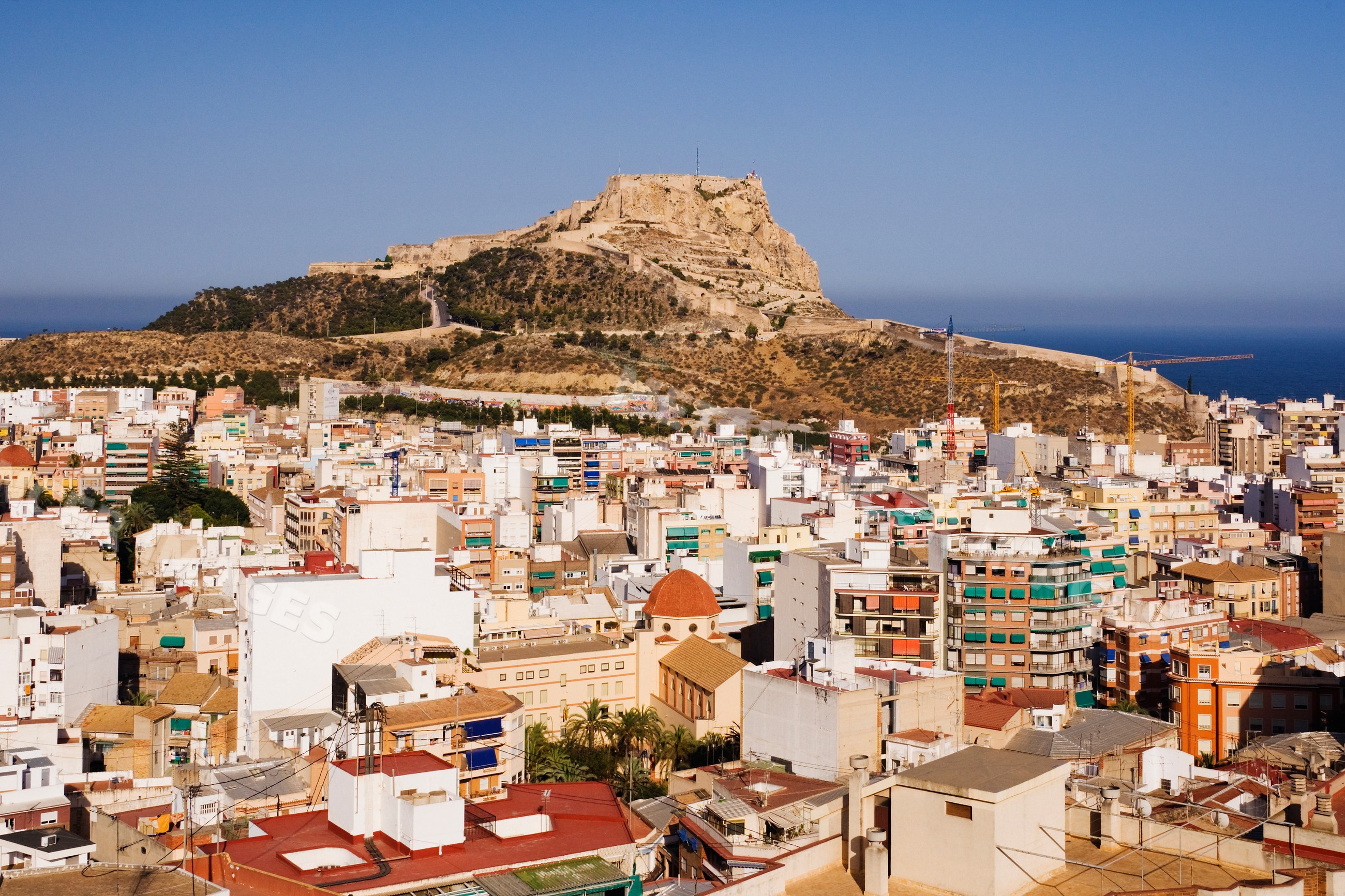 Castillo de santa barbara and alicante cityscape with mediterranean