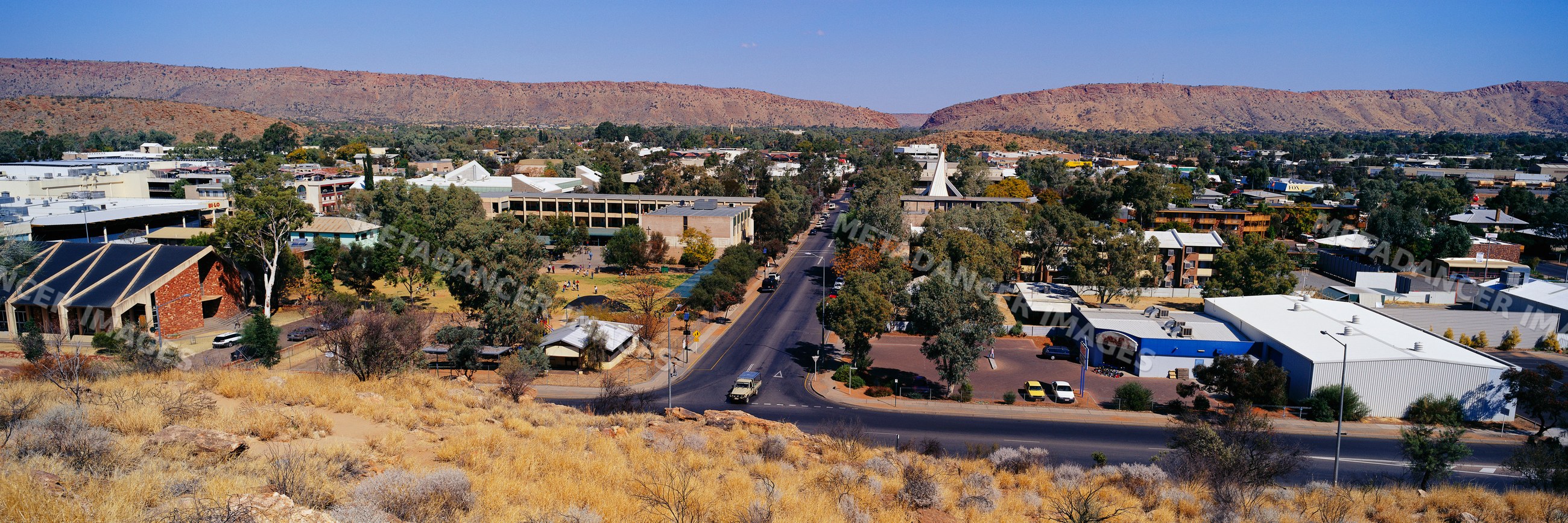 Panoramic view of alice springs town and arid landscape