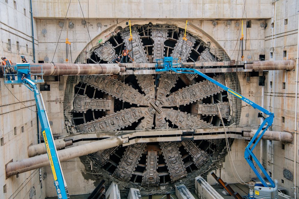 Tunnel boring machine undergoing maintenance at a construction site