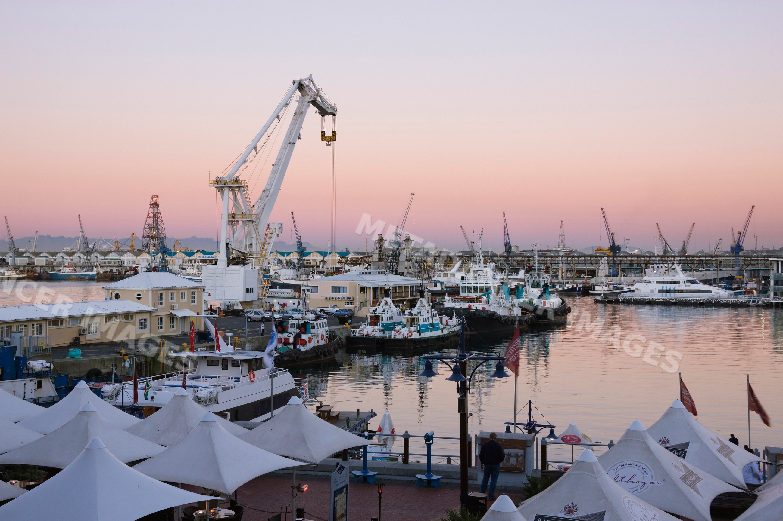 Victoria & alfred waterfront harbor with boats and cranes
