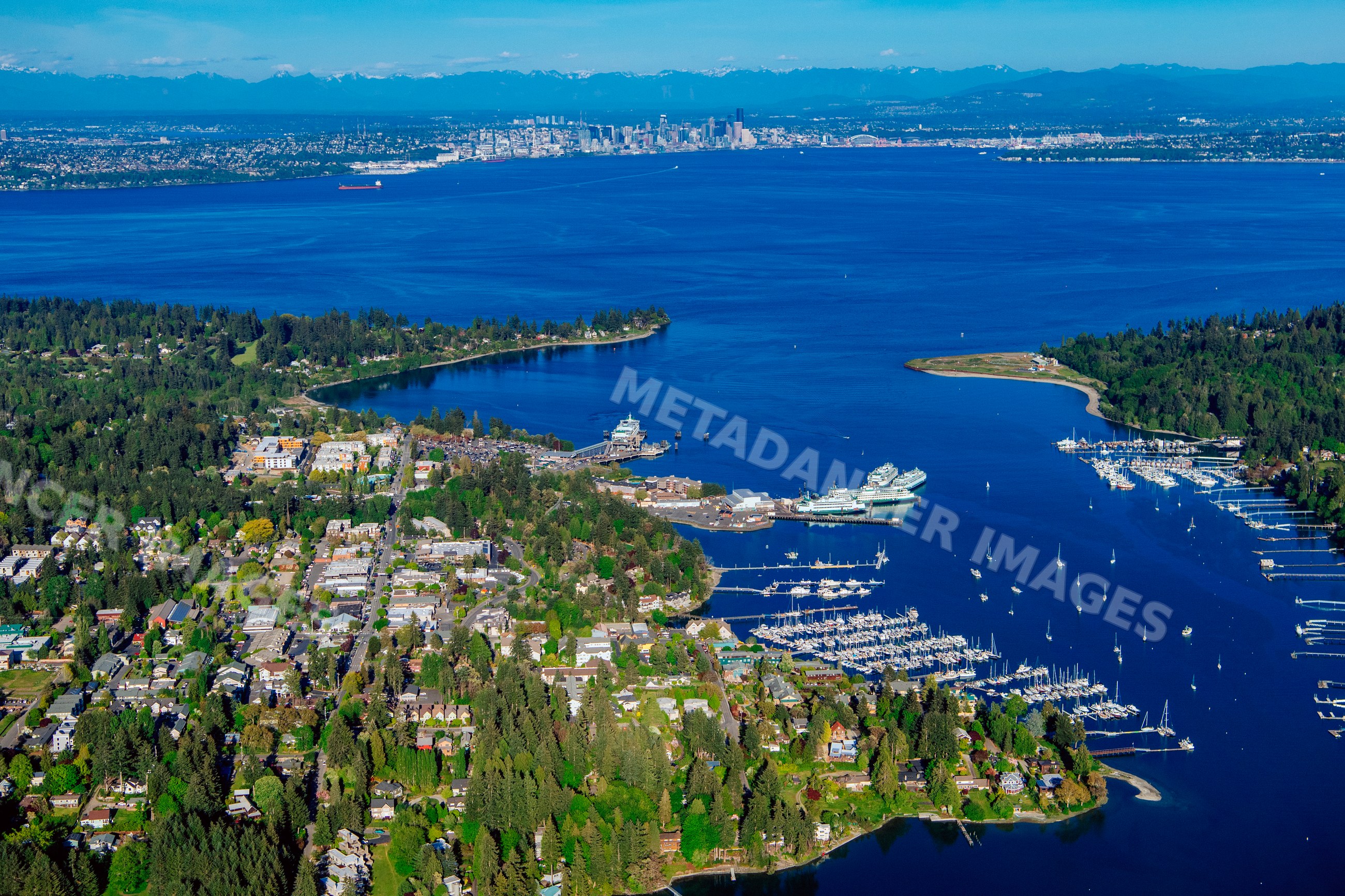 Aerial view of Bainbridge Island's Eagle Harbor marina and seattle