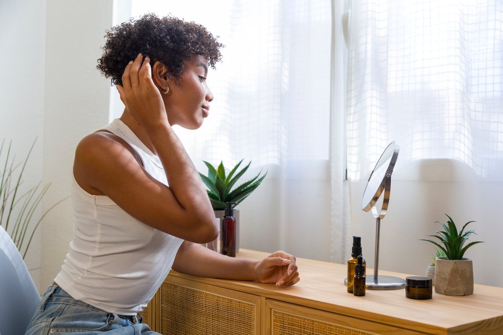 Young African American woman grooming