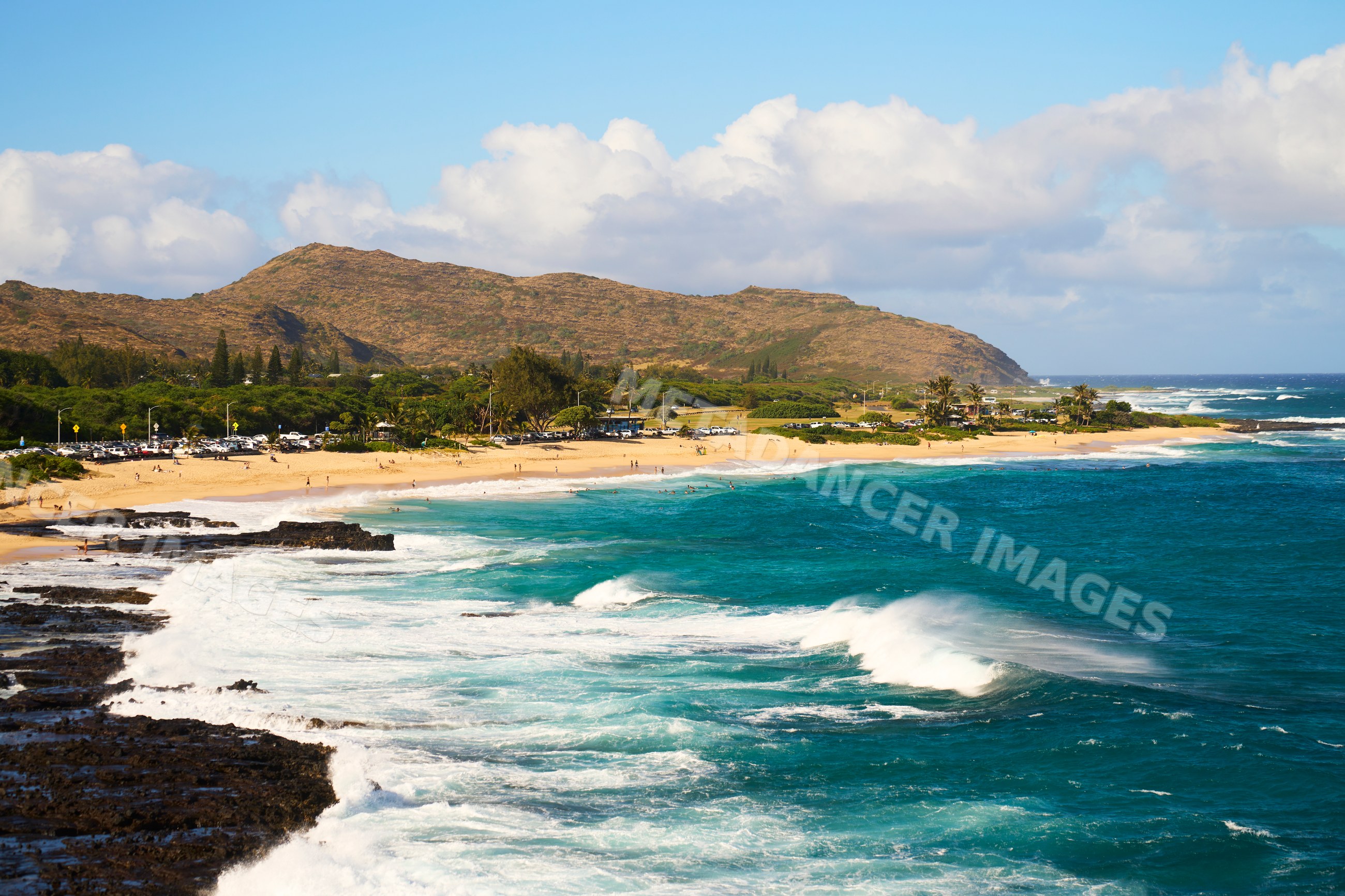 Scenic beach with waves and mountains, Hawaii