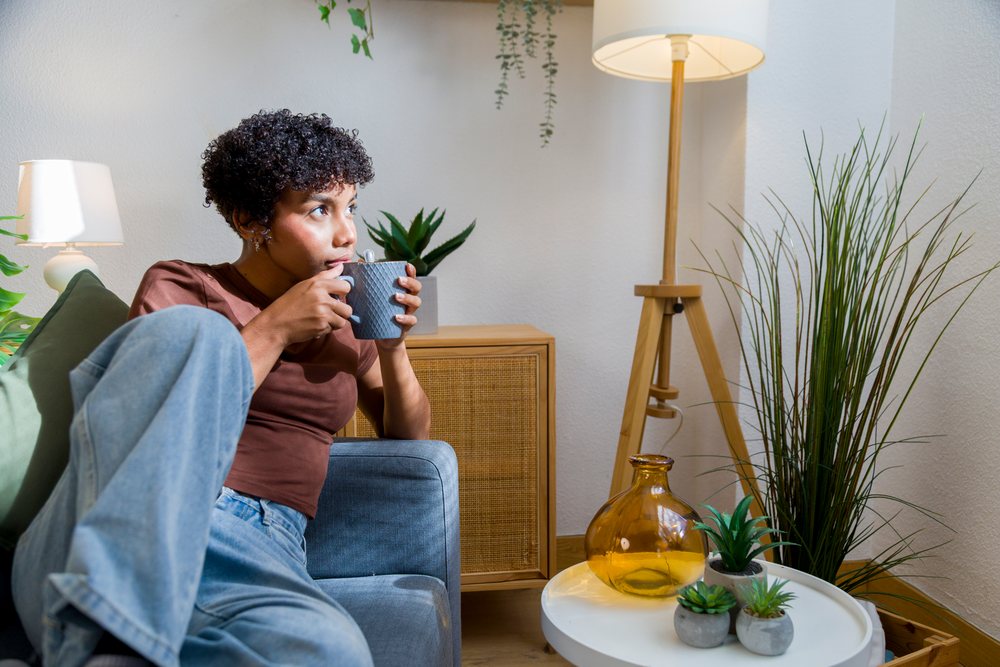 Young African American woman drinking coffee
