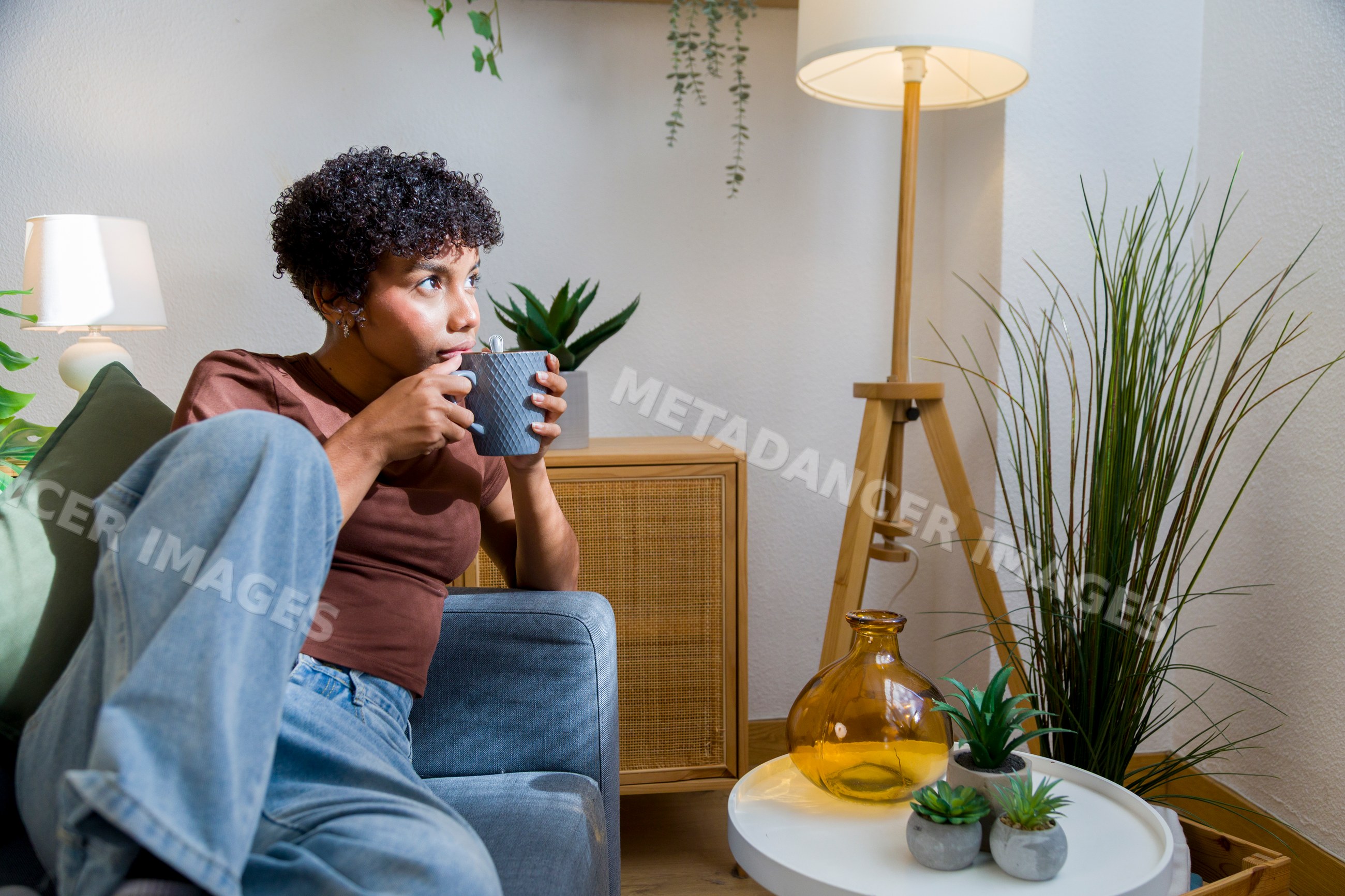Young African American woman drinking coffee