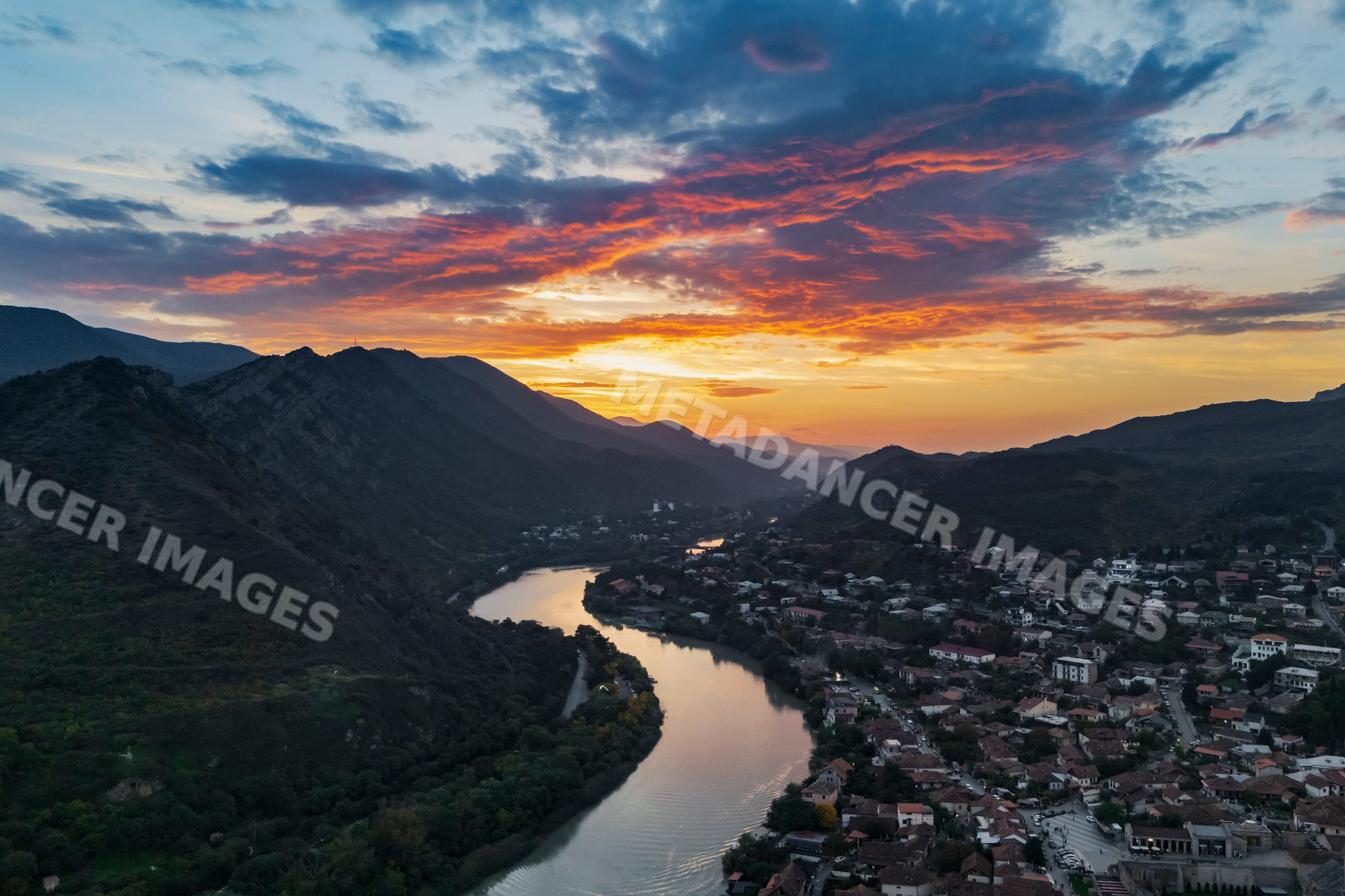 Mtskheta City and Mtkvari (Kura) River flowing at Sunset in Georgia