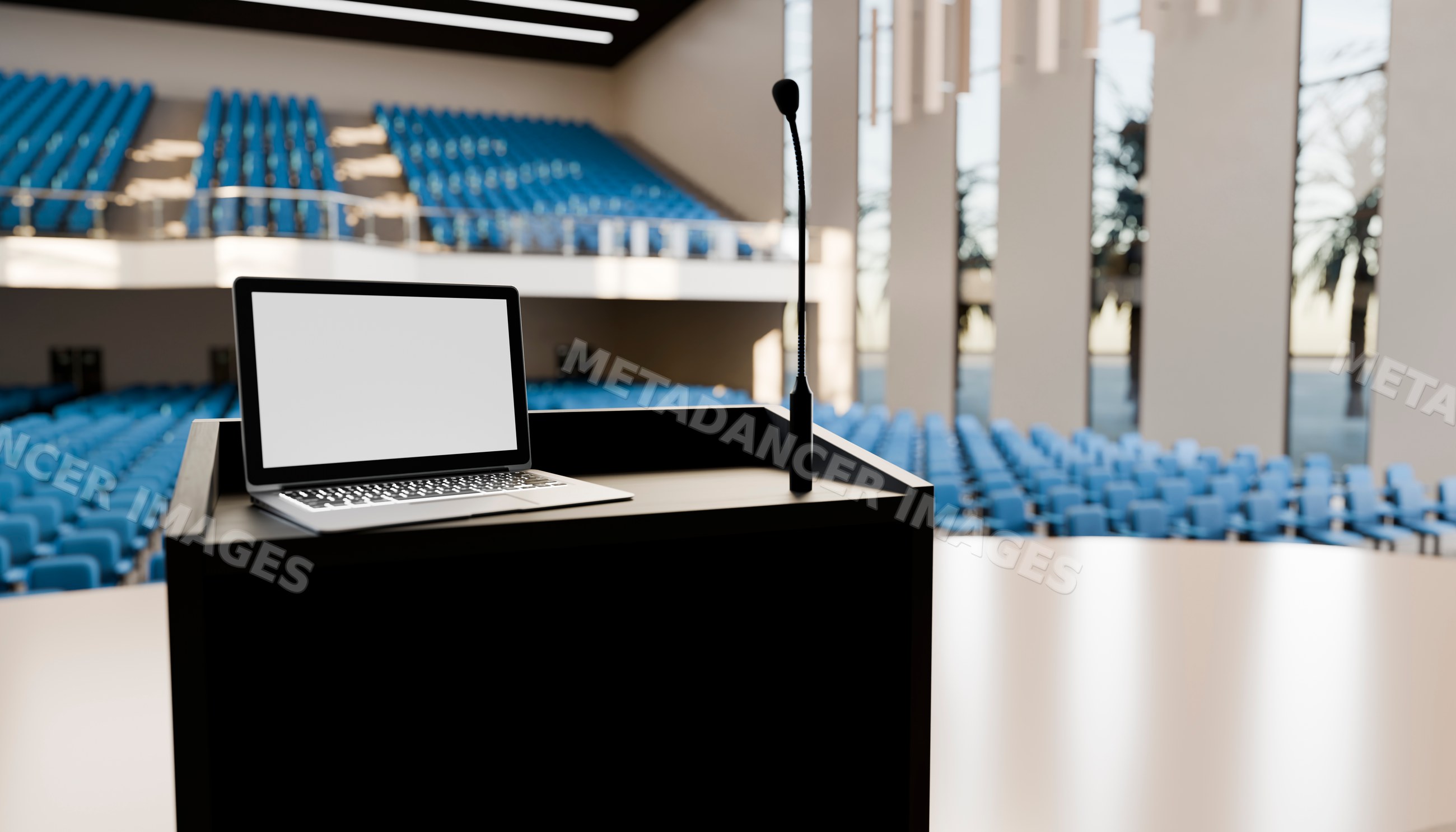 Podium with laptop and microphone in empty conference room
