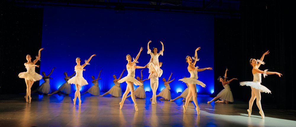 Ballet dancers perform a classical holiday ballet on stage