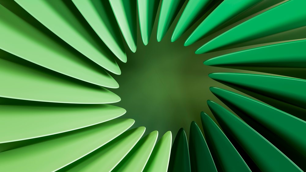 Green abstract radial blades forming a circular aerodynamic pattern