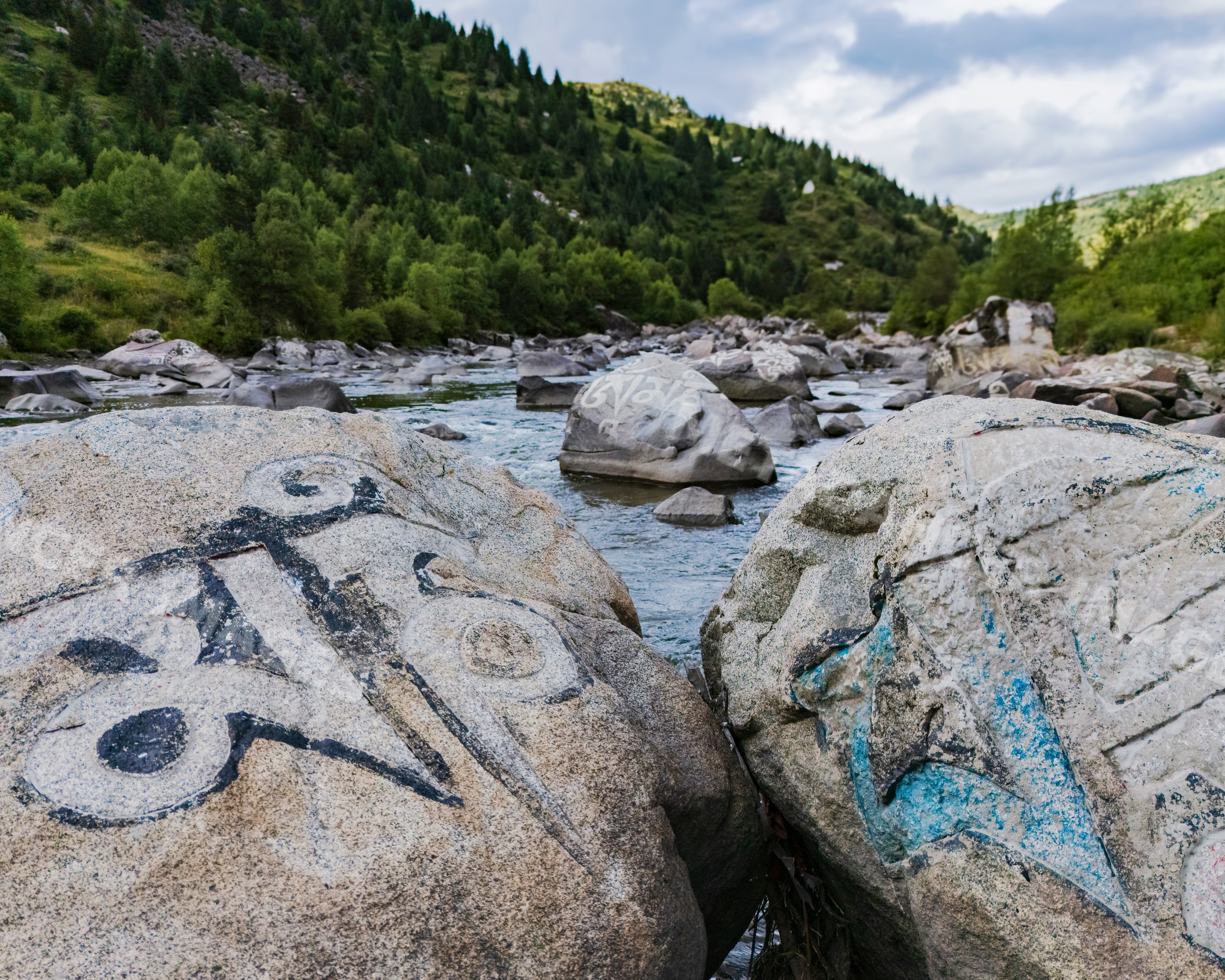 Mani Rocks with tibetan script in River at tagong, sichuan province