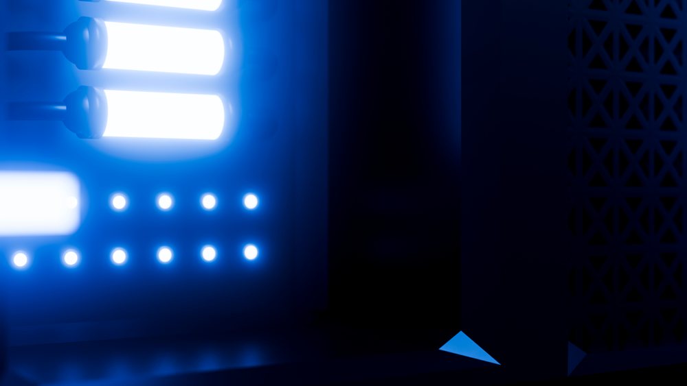 Blue led lights illuminating electronic panel with glowing tubes