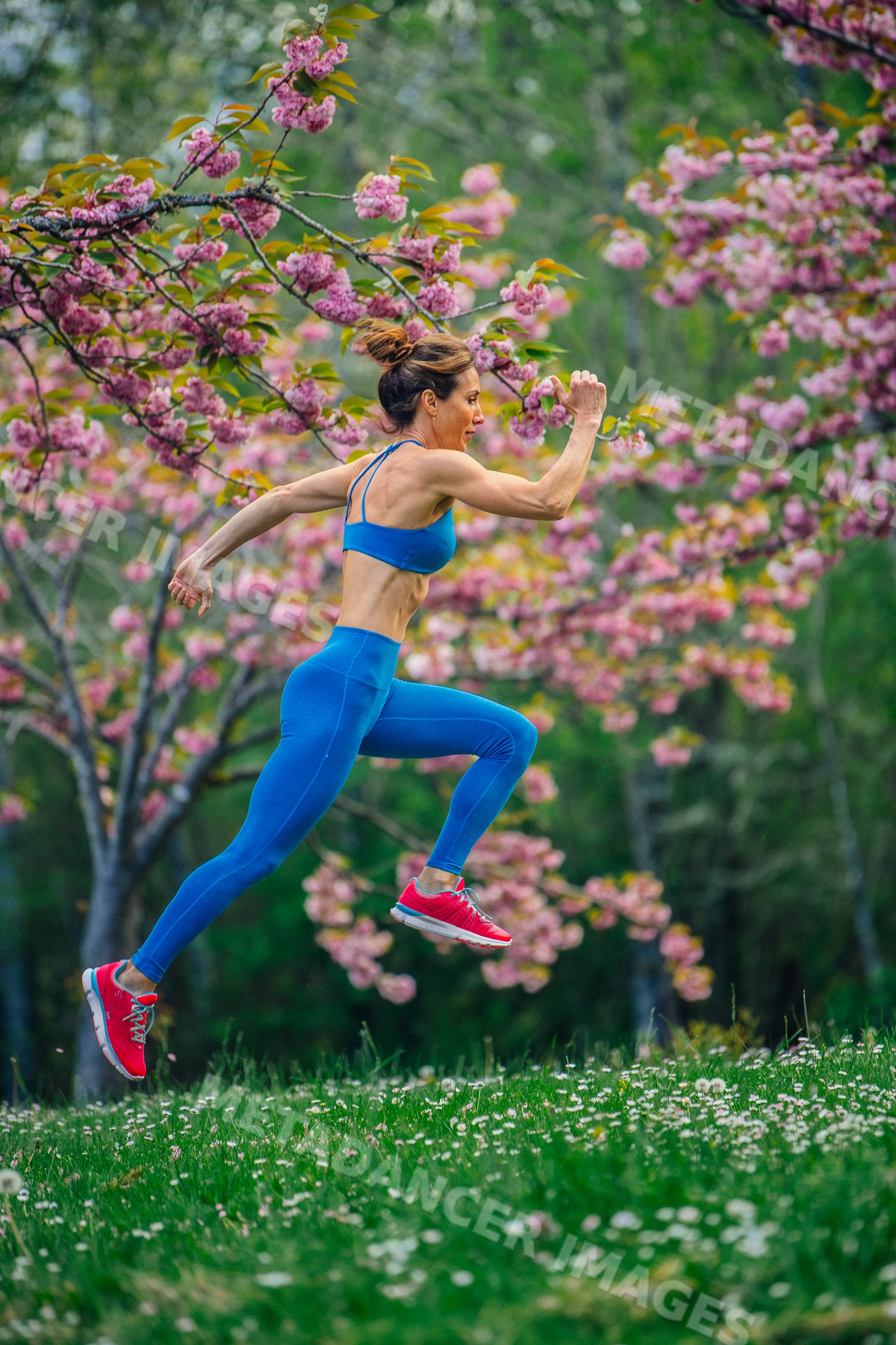White woman jumping outdoors