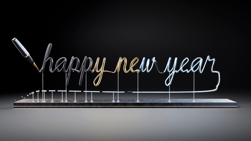 Glowing happy new year neon sign with pen tip on metal base