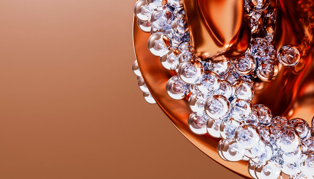 Transparent bubbles clustering on a metallic orange surface abstract
