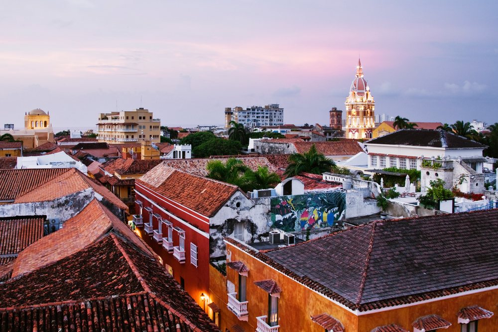 Cityscape of cartagena with cathedral and rooftops at sunset
