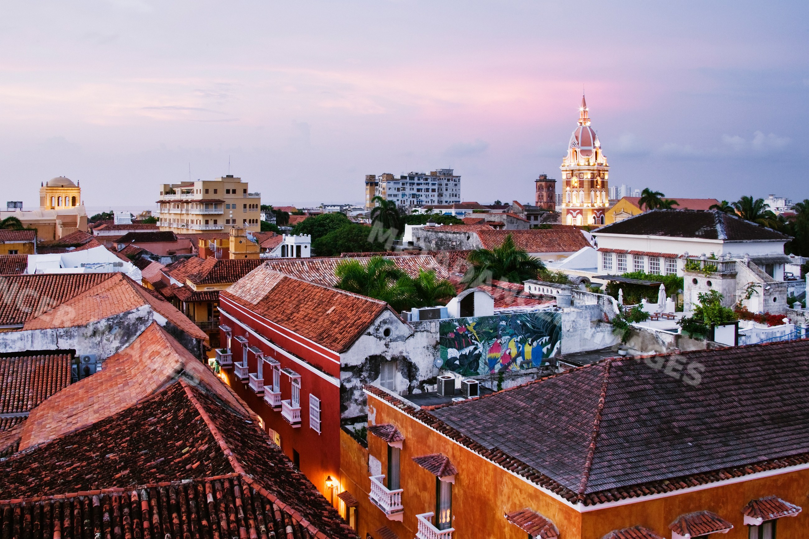 Cityscape of cartagena with cathedral and rooftops at sunset