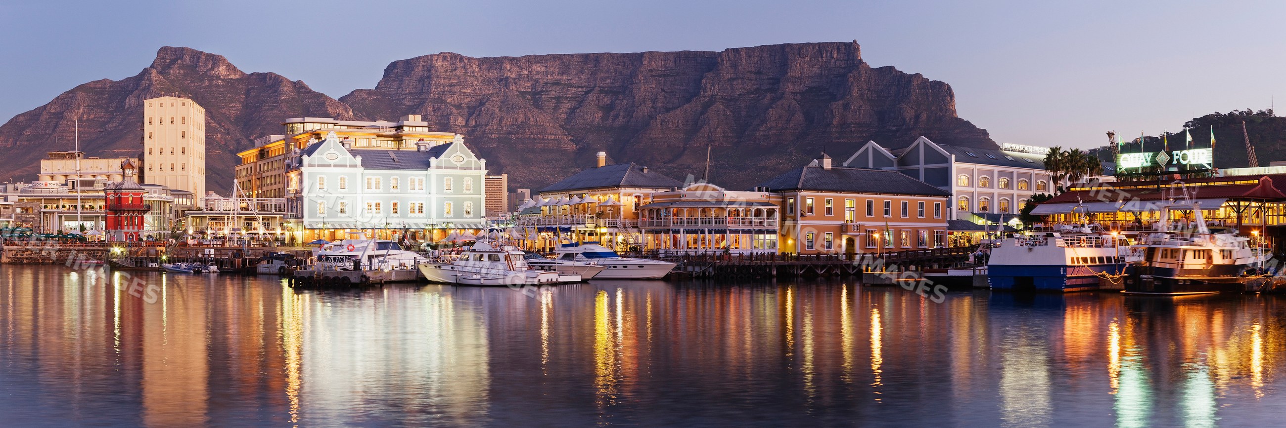 Victoria and alfred waterfront harbor with boats and table mountain