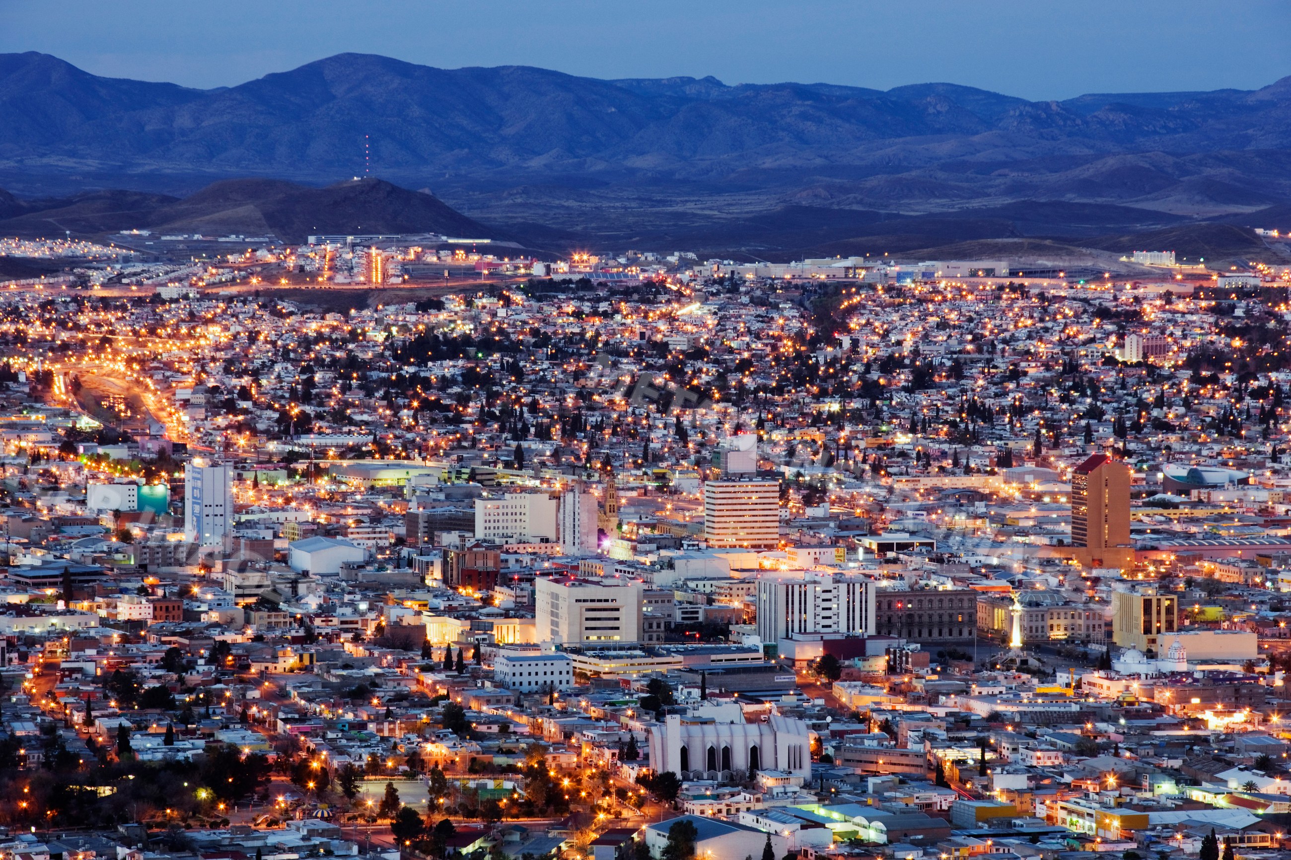 Night cityscape of chihuahua city with illuminated buildings