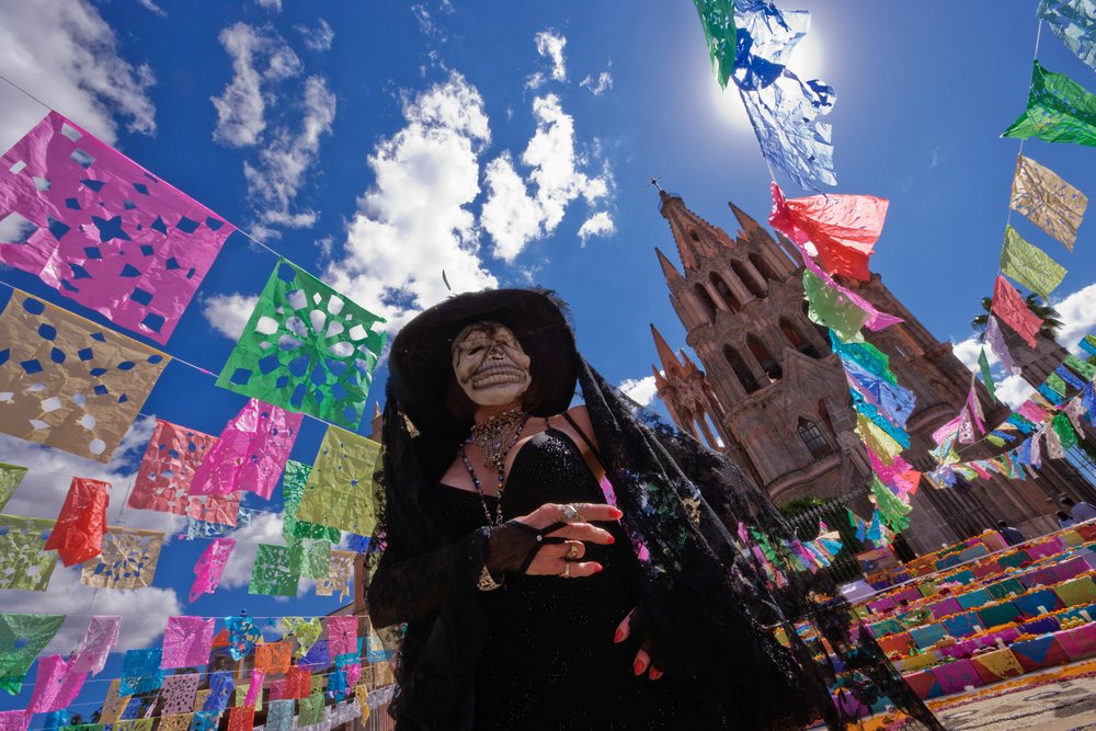 Woman in day of the dead costume with skull face paint