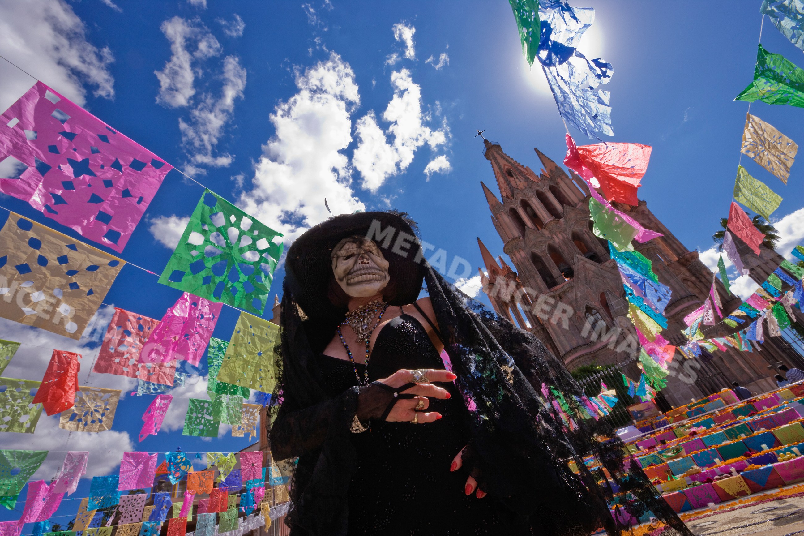 Woman in day of the dead costume with skull face paint