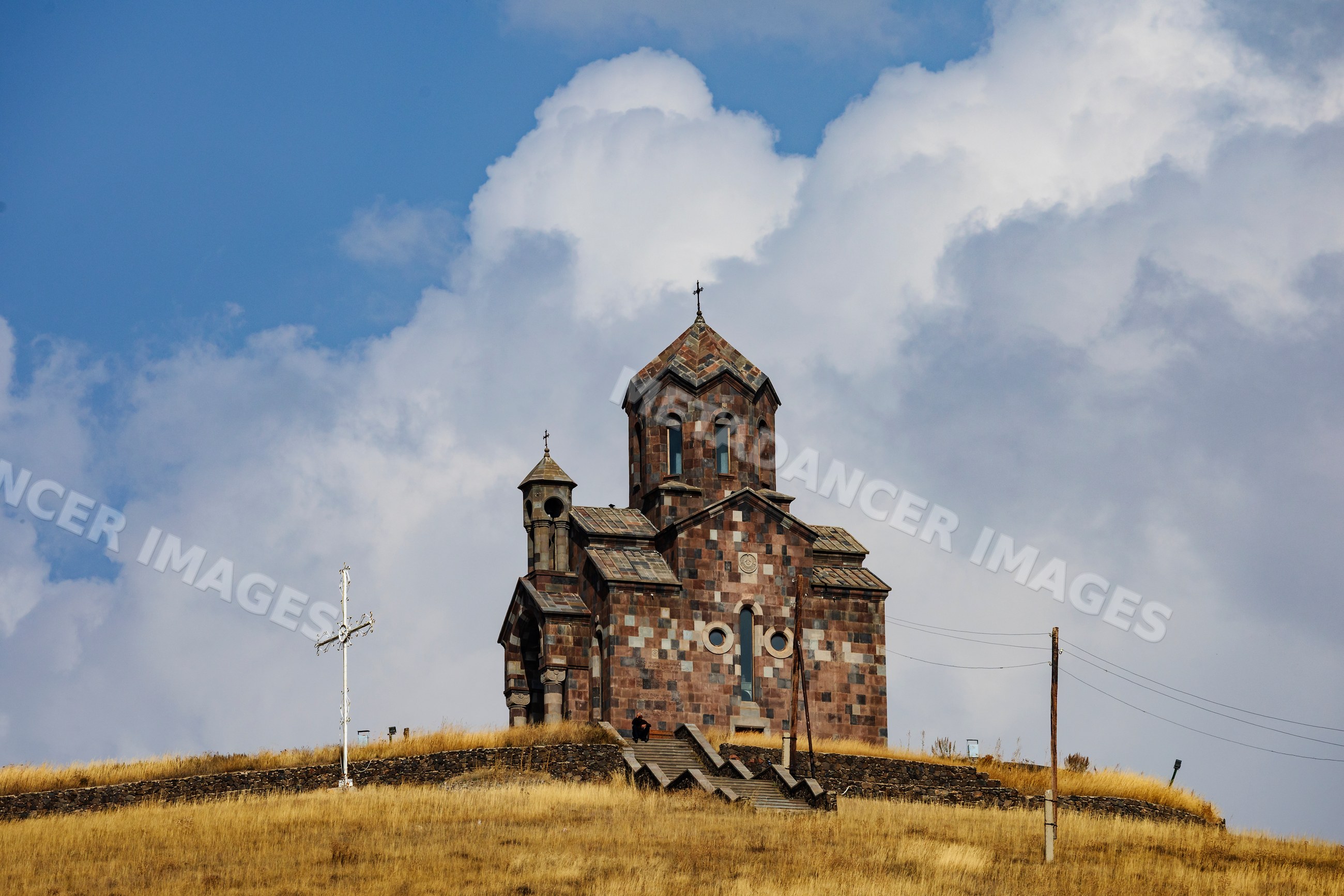 St Sarkis Church atop grassy hill in tsakhunk, Armenia