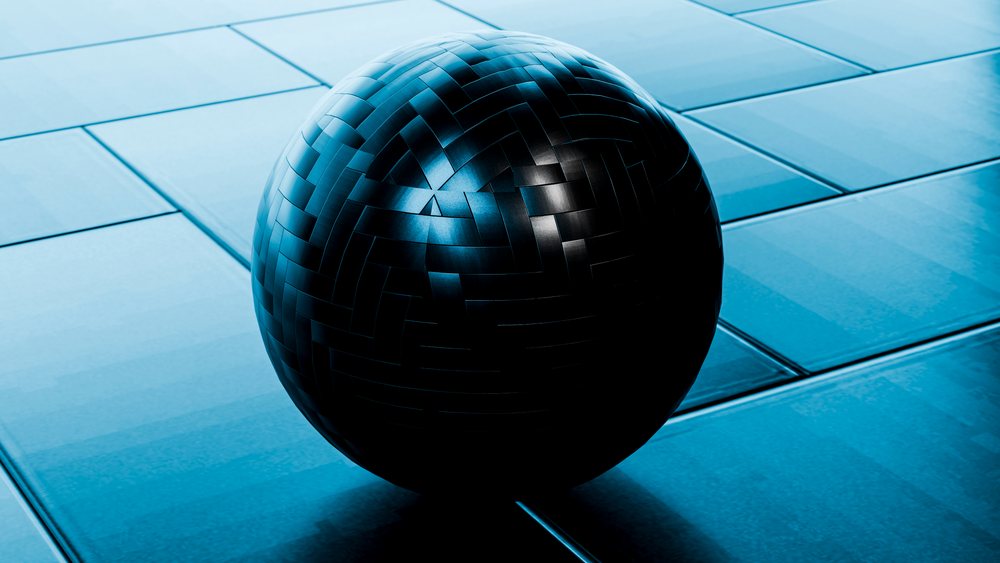 Black woven sphere sculpture on blue tiled floor