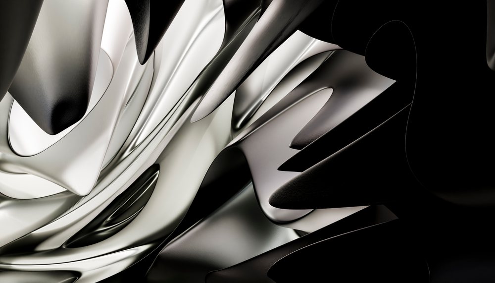 Close-up of smooth, curved metallic shapes with reflective surfaces