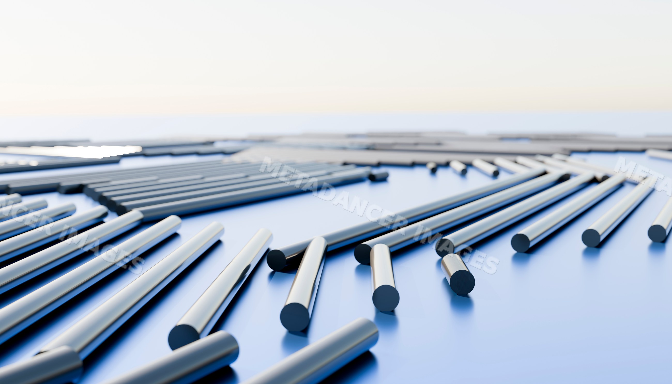Metal cylindrical rods arranged in a linear pattern on blue surface