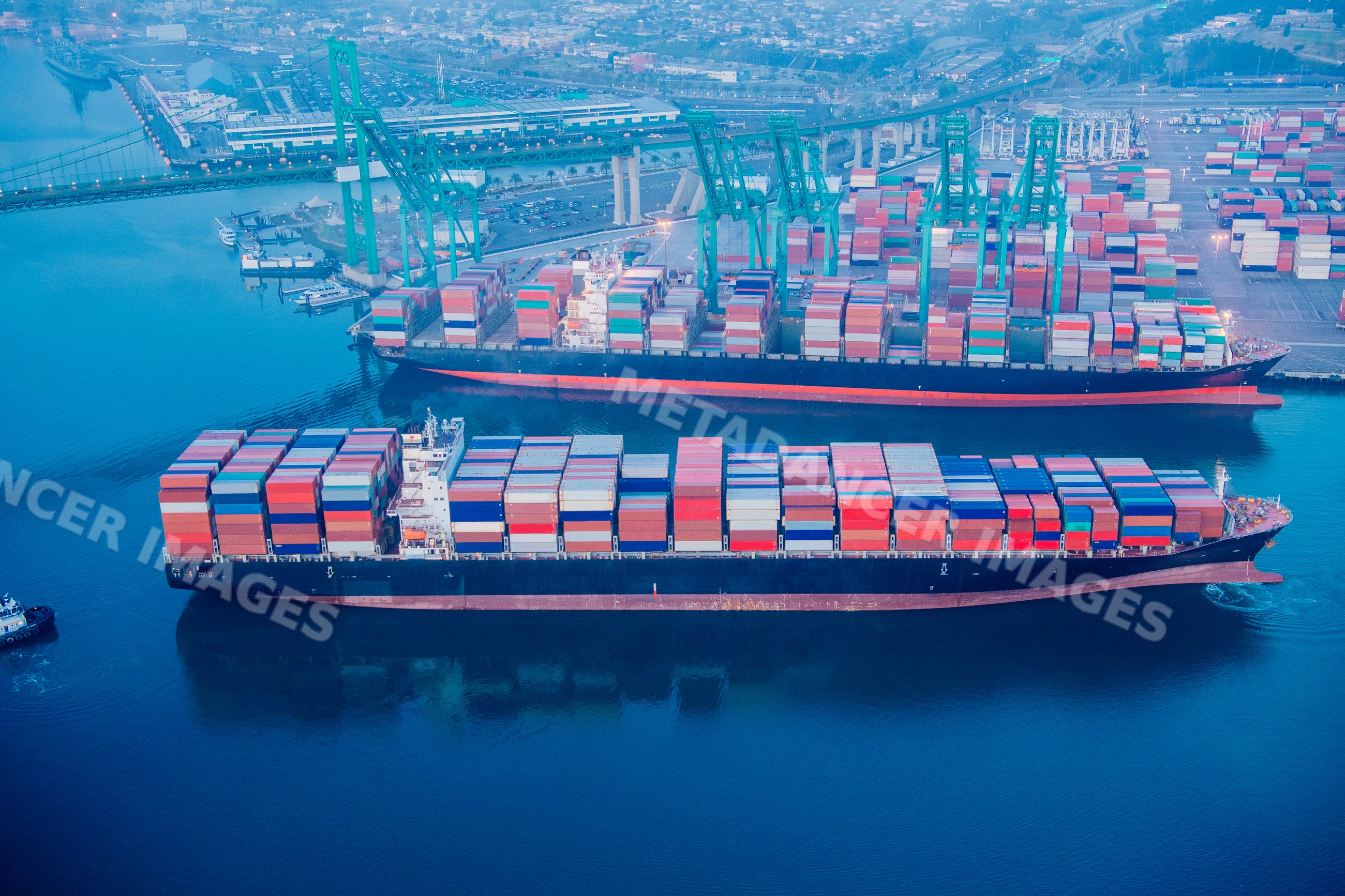 Container ships loaded with cargo at a container terminal in a beach
