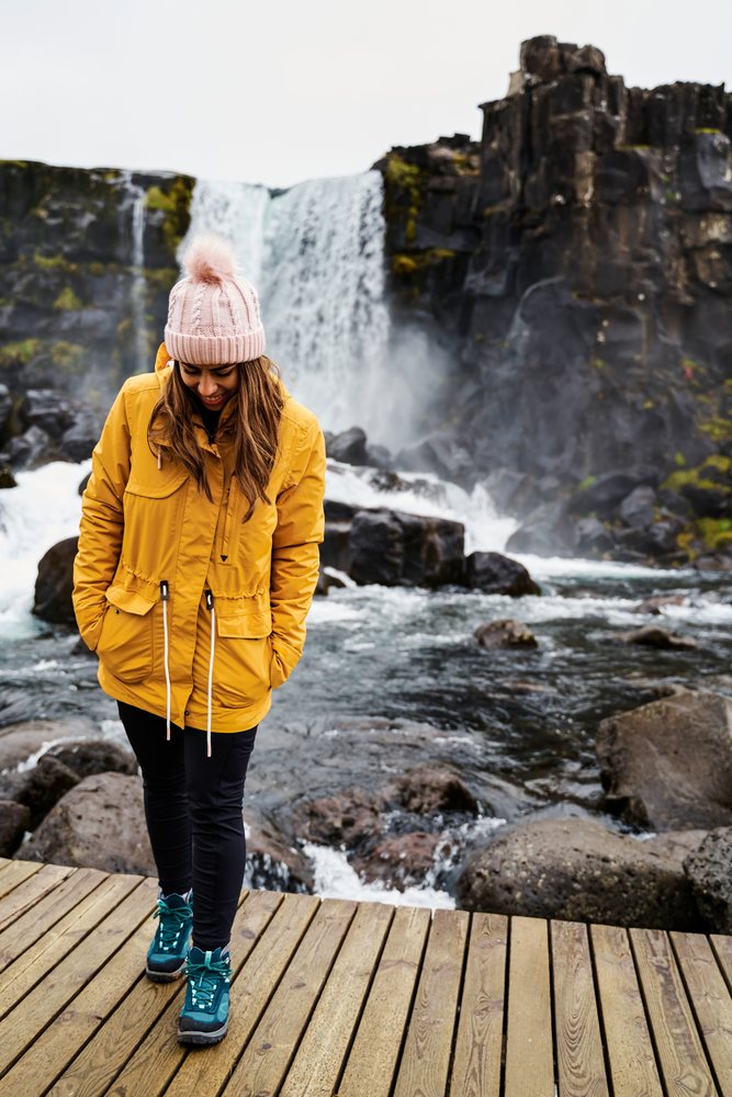 A white woman enjoys hiking