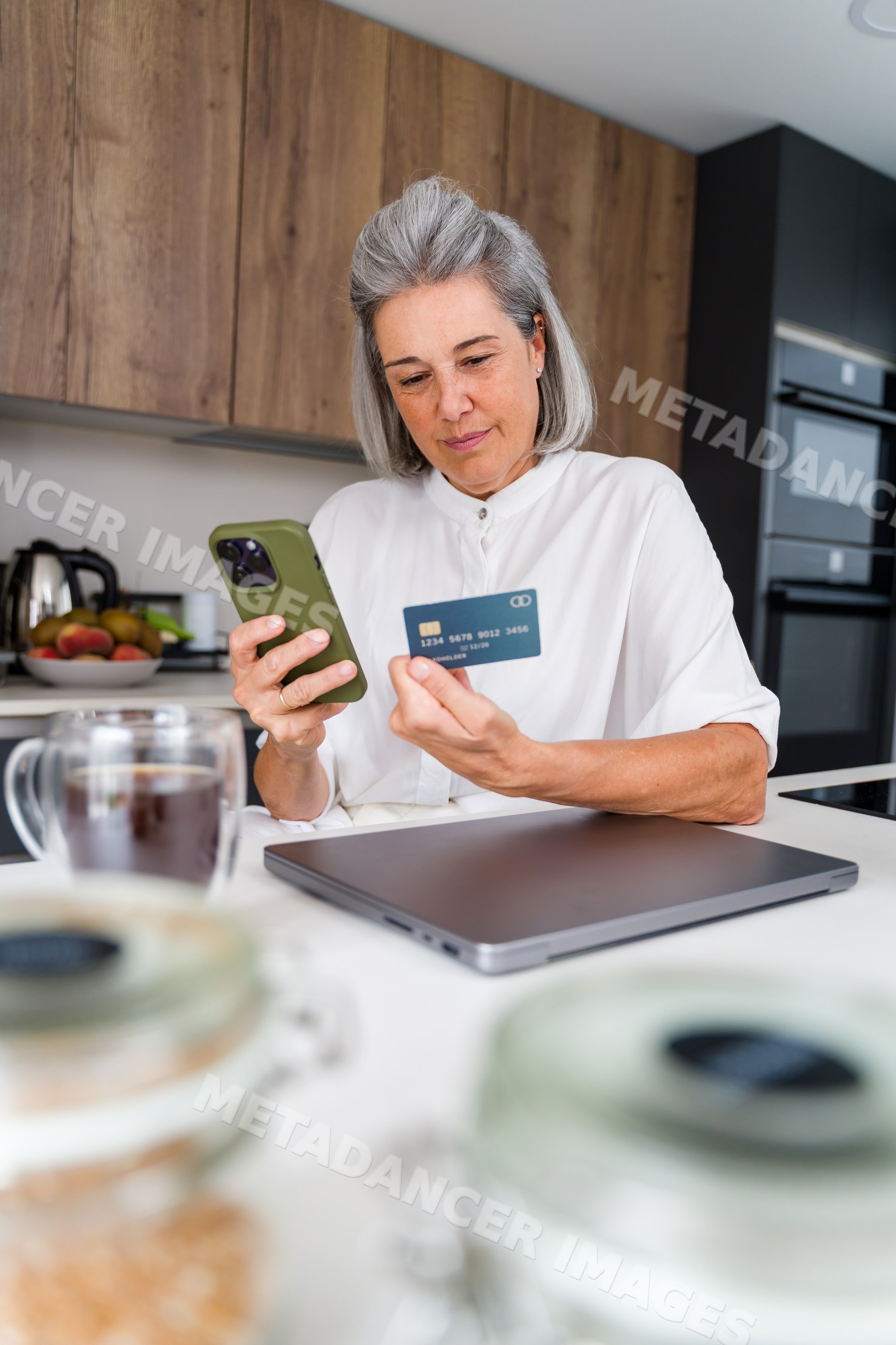 White Woman using smartphone and credit card for online payment