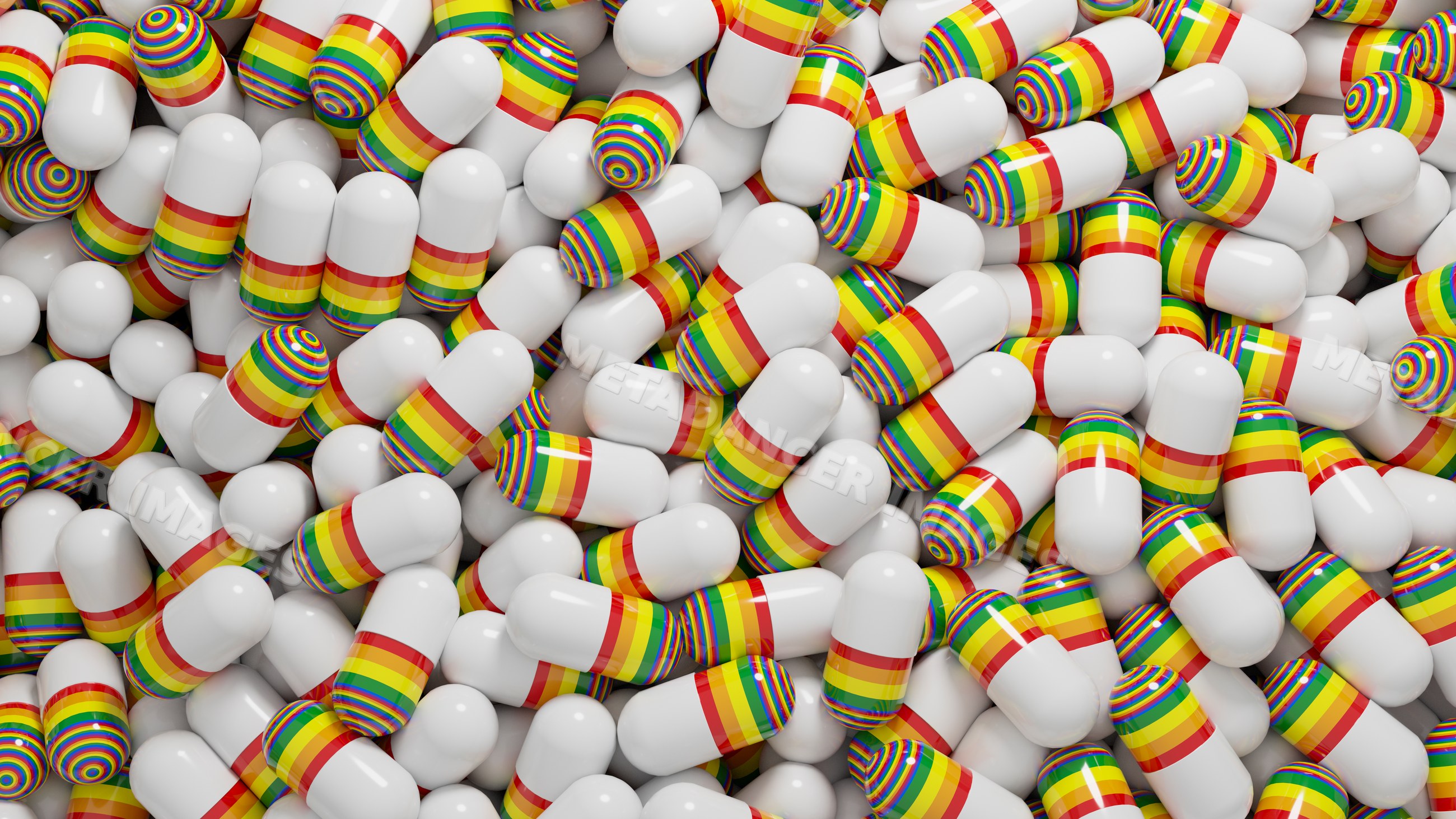 White medication capsules with rainbow stripes piled in close-up view