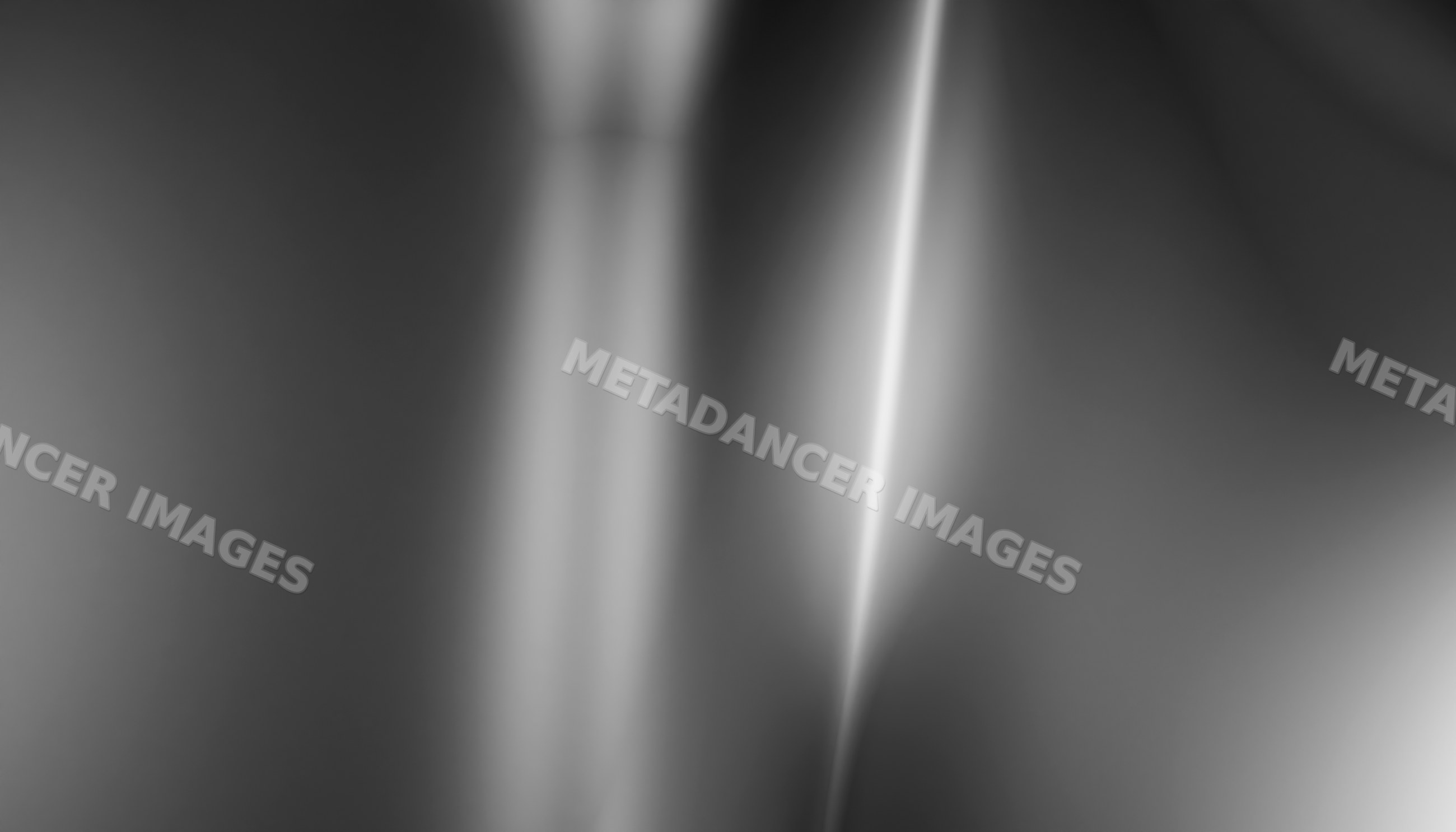 Abstract blurred gray and white light streaks creating a soft glowing