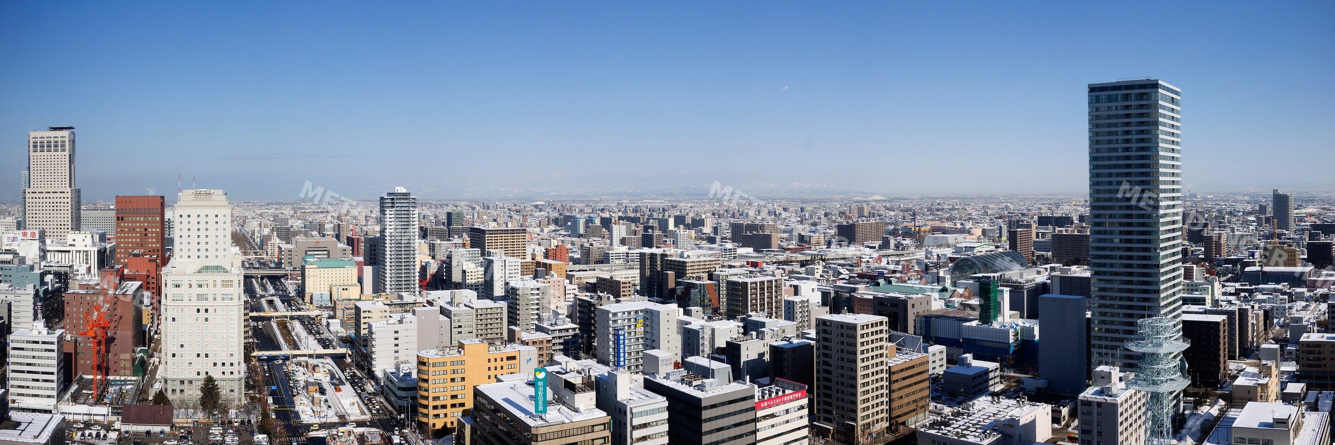 City skyline of sapporo with snowy streets japan