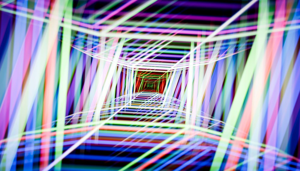 Neon light tunnel with colorful geometric patterns in abstract design