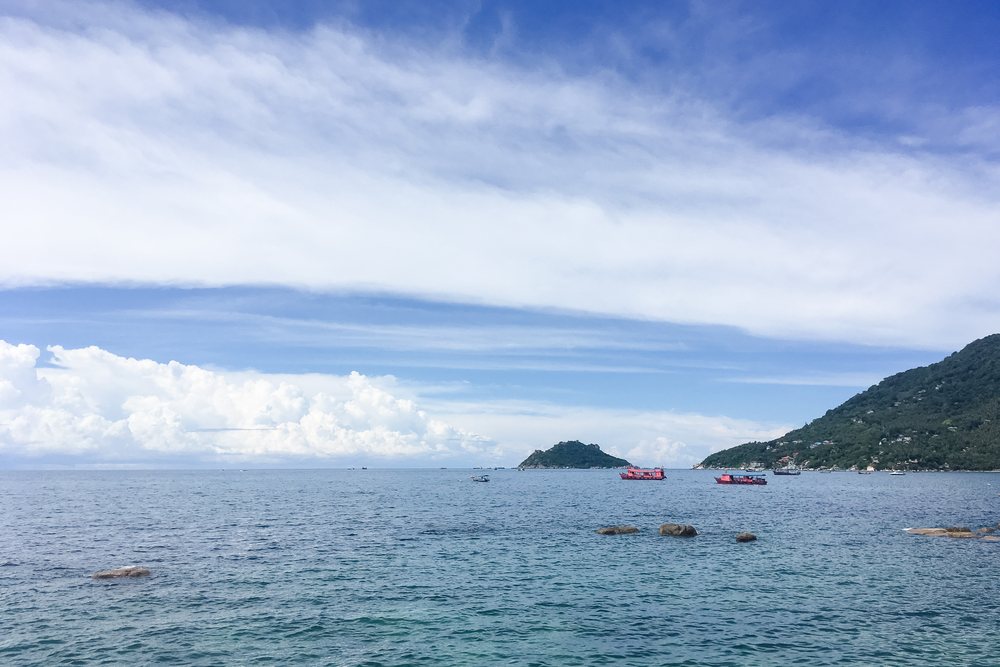 Sea view with island, mountain, and boats