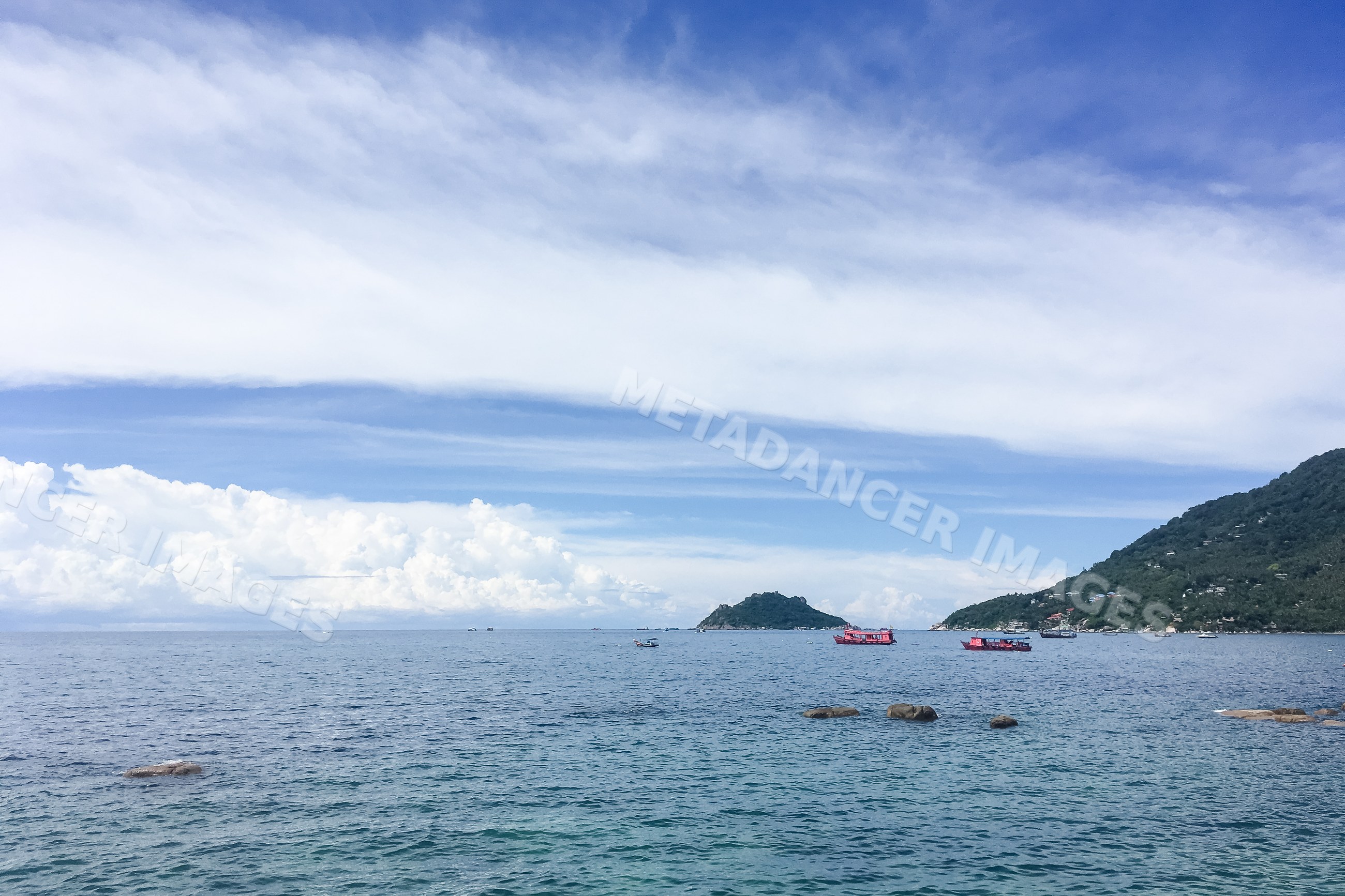 Sea view with island, mountain, and boats