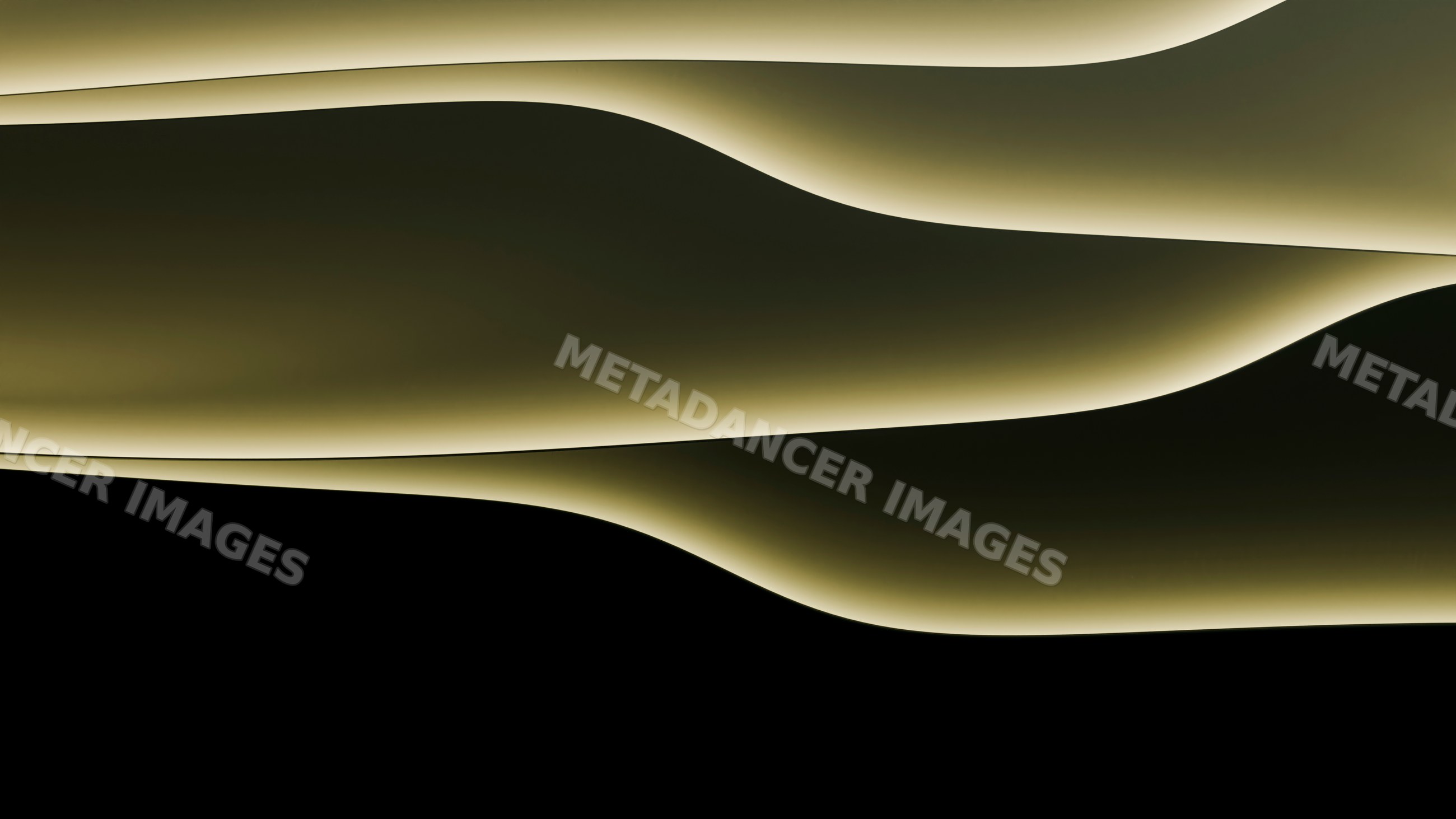 Abstract illuminated curved wall with flowing light and shadow