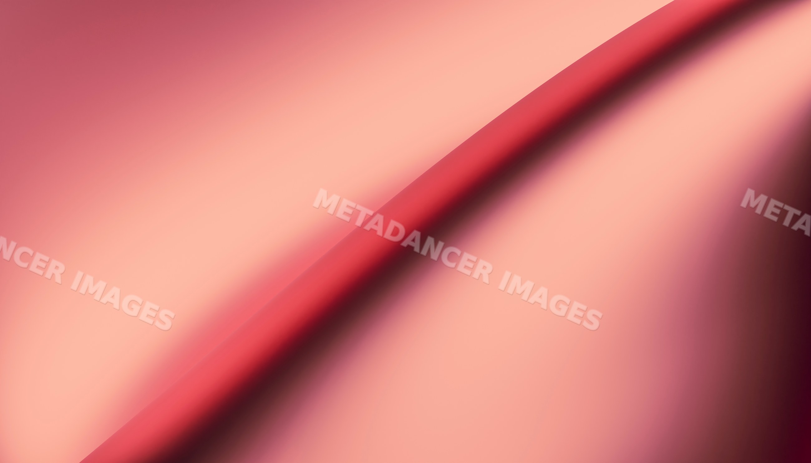 Close-up image of smooth red fabric with gentle folds and wrinkles
